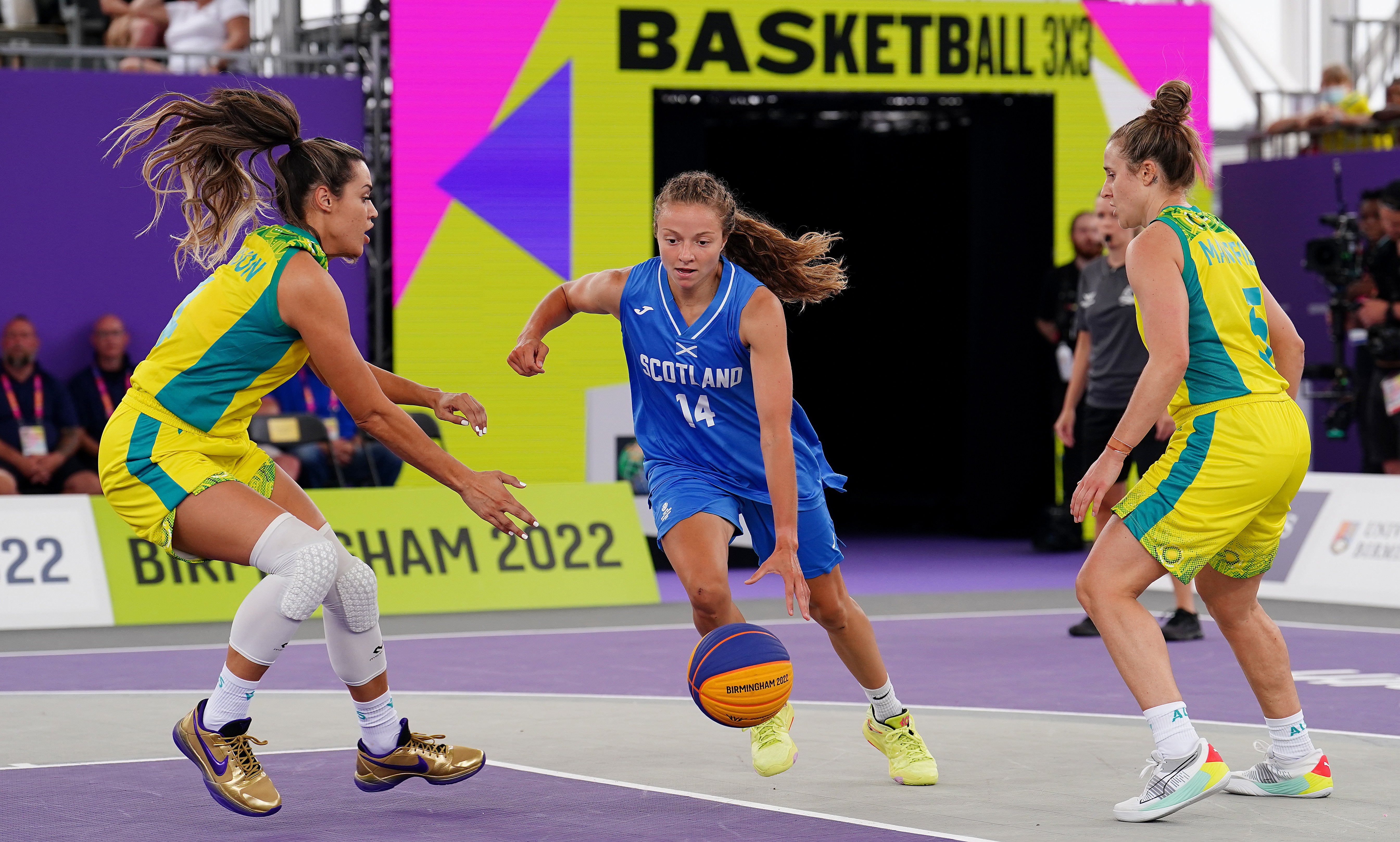 Scotland’s Kennedy Leonard drives past Australia’s Alex Wilson (Martin Rickett/PA)