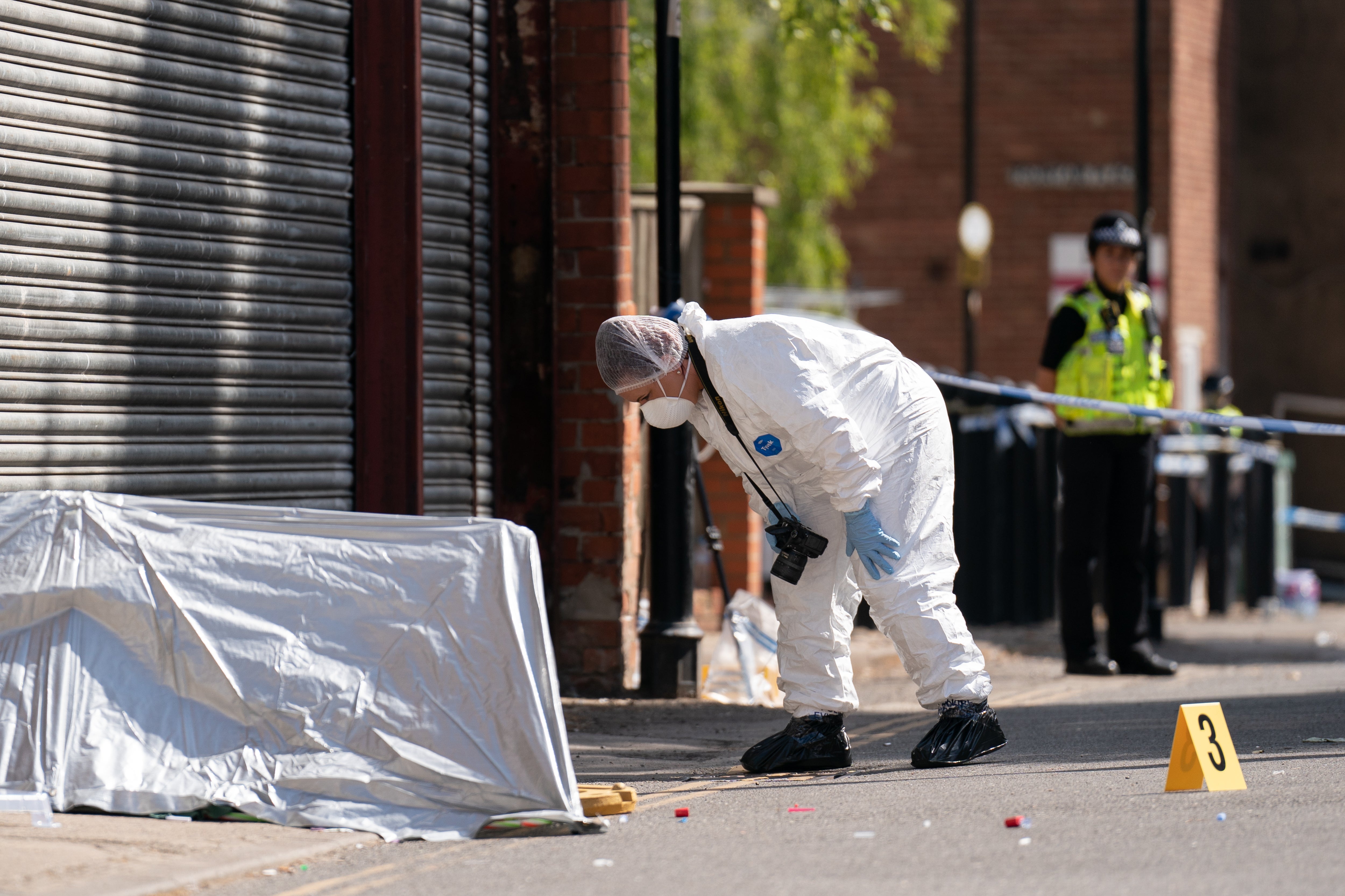 A forensic officer near the scene of the stabbing in Boston