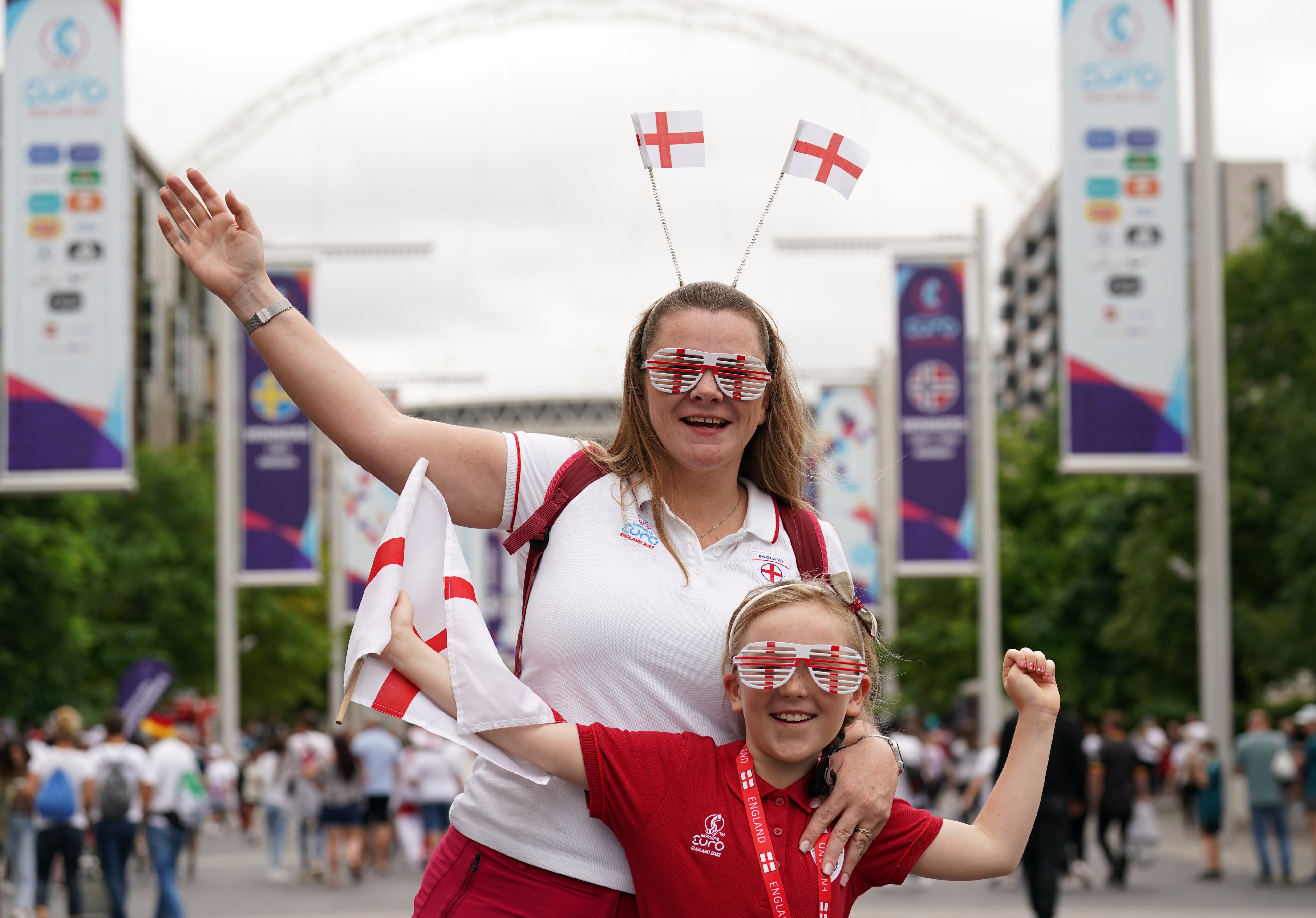 England fans pose for a photo on Wembley Way (Joe Giddens/PA)