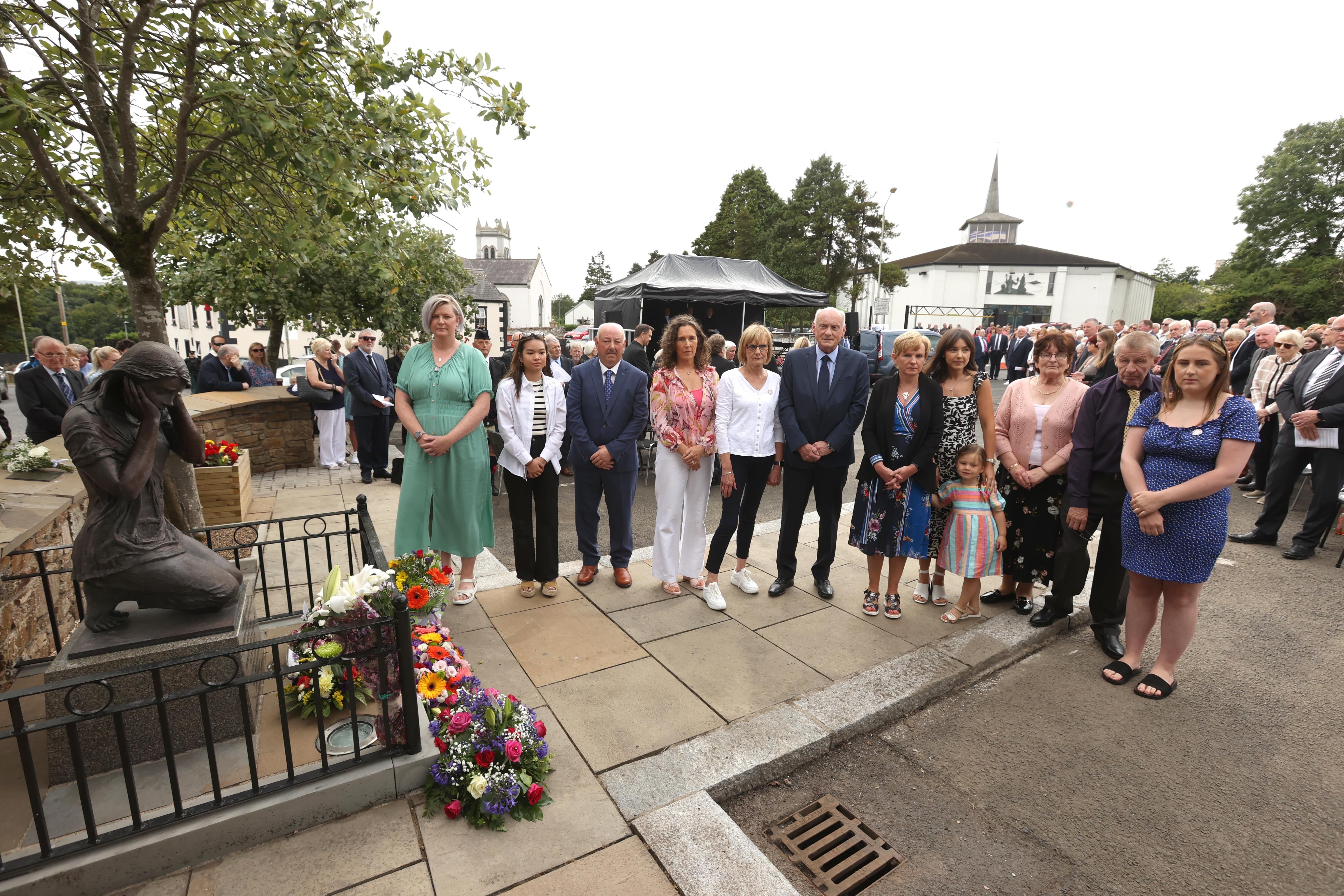 Bombing victim family members at a service in Claudy, Co Londonderry (Liam McBurney/PA)