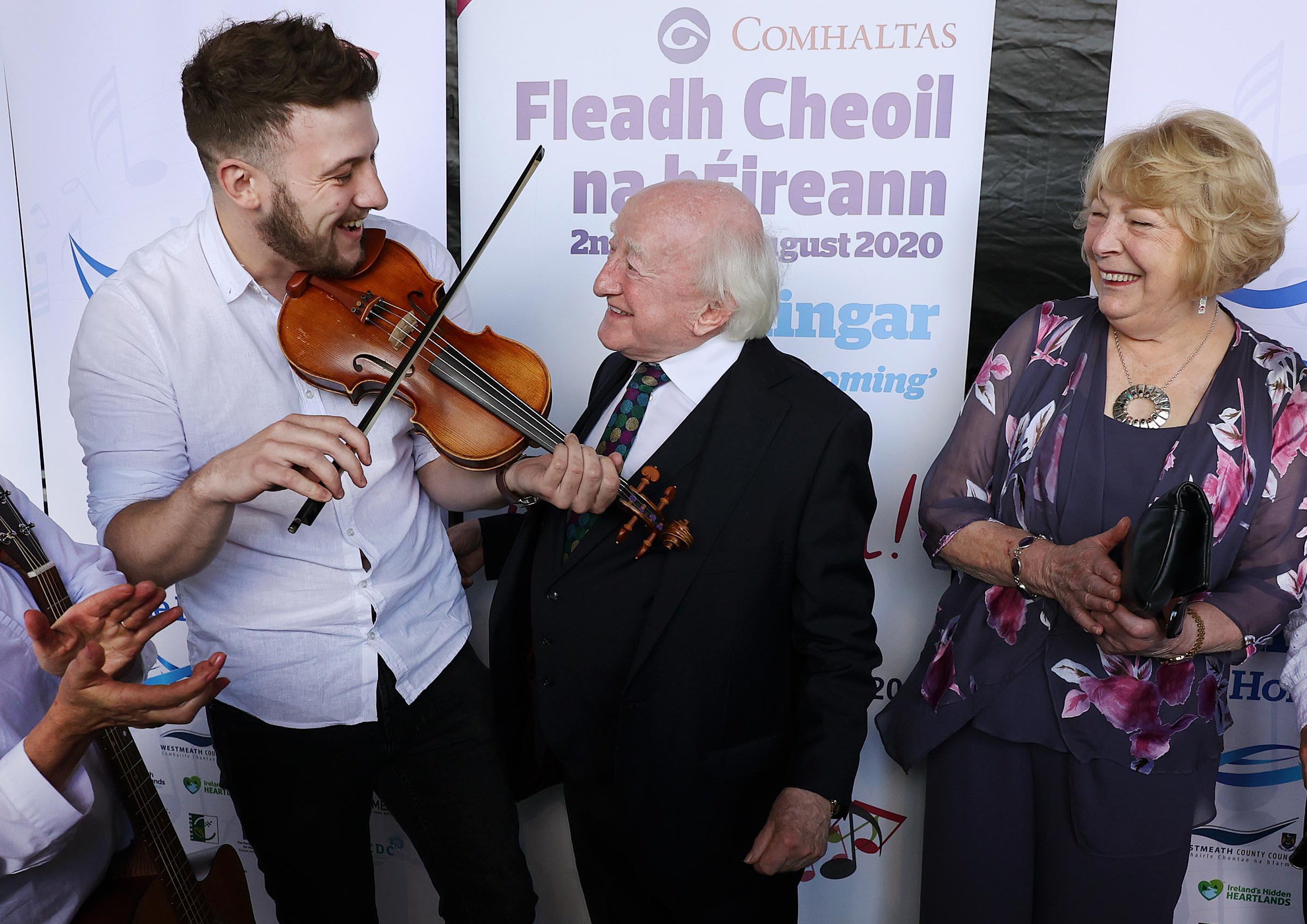 President Michael D Higgins and his wife Sabina with musician Daniel Boland (PA)