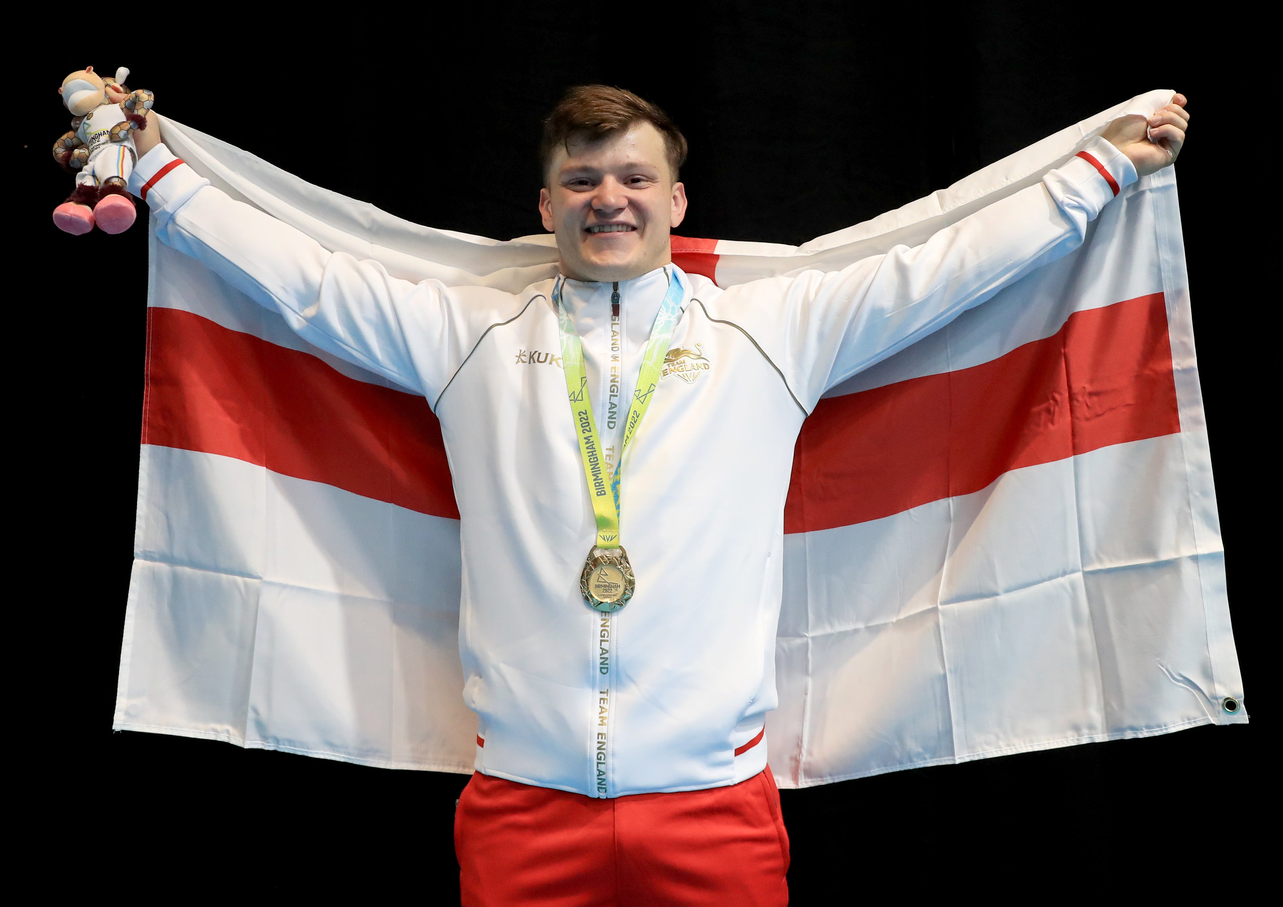 England’s Chris Murray celebrates after winning weightlifting gold at Birmingham 2022 (Bradley Collyer/PA)