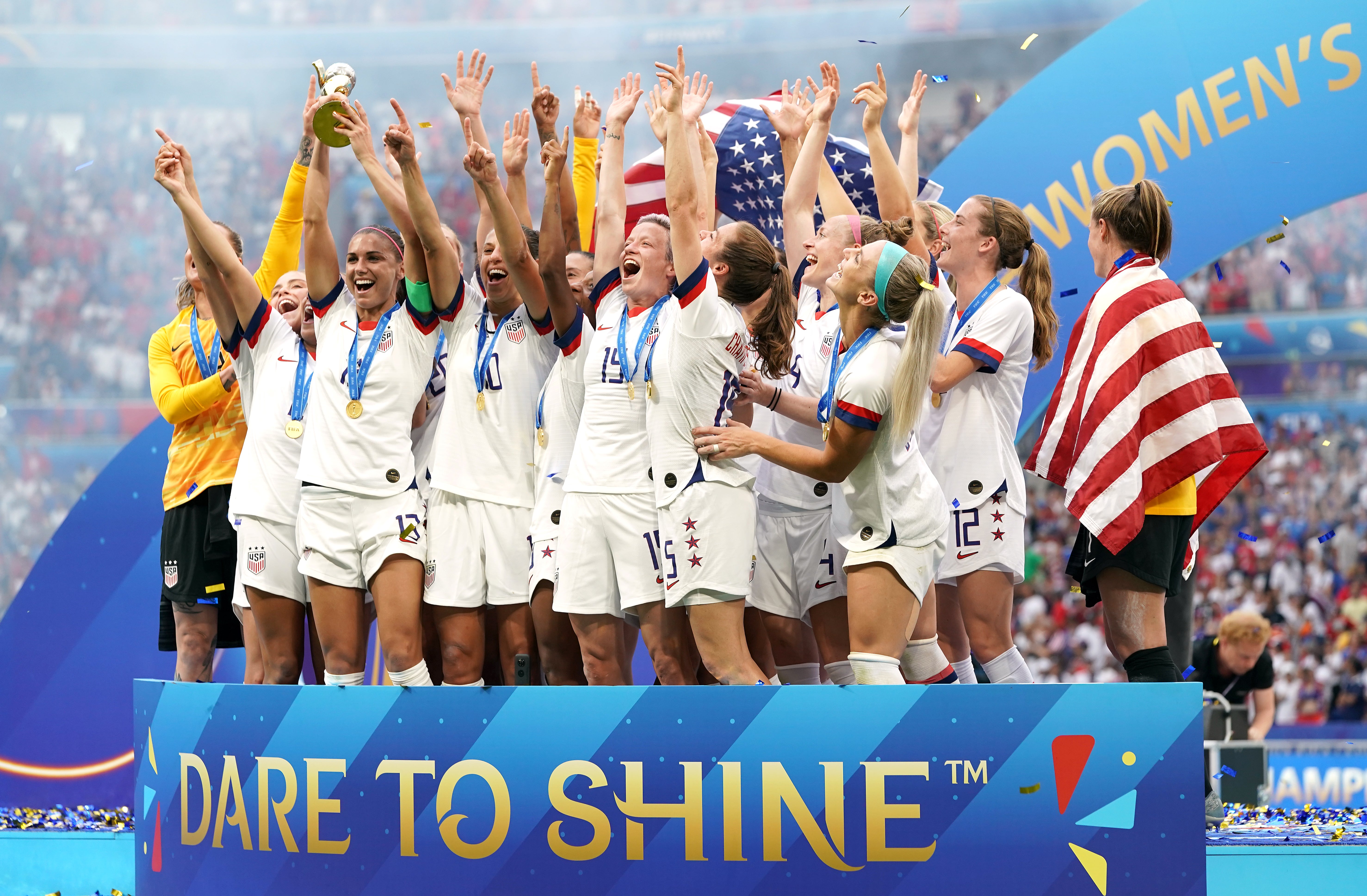 The USA’s Megan Rapinoe (centre) and her team-mates celebrate their 2019 World Cup win (PA Wire)