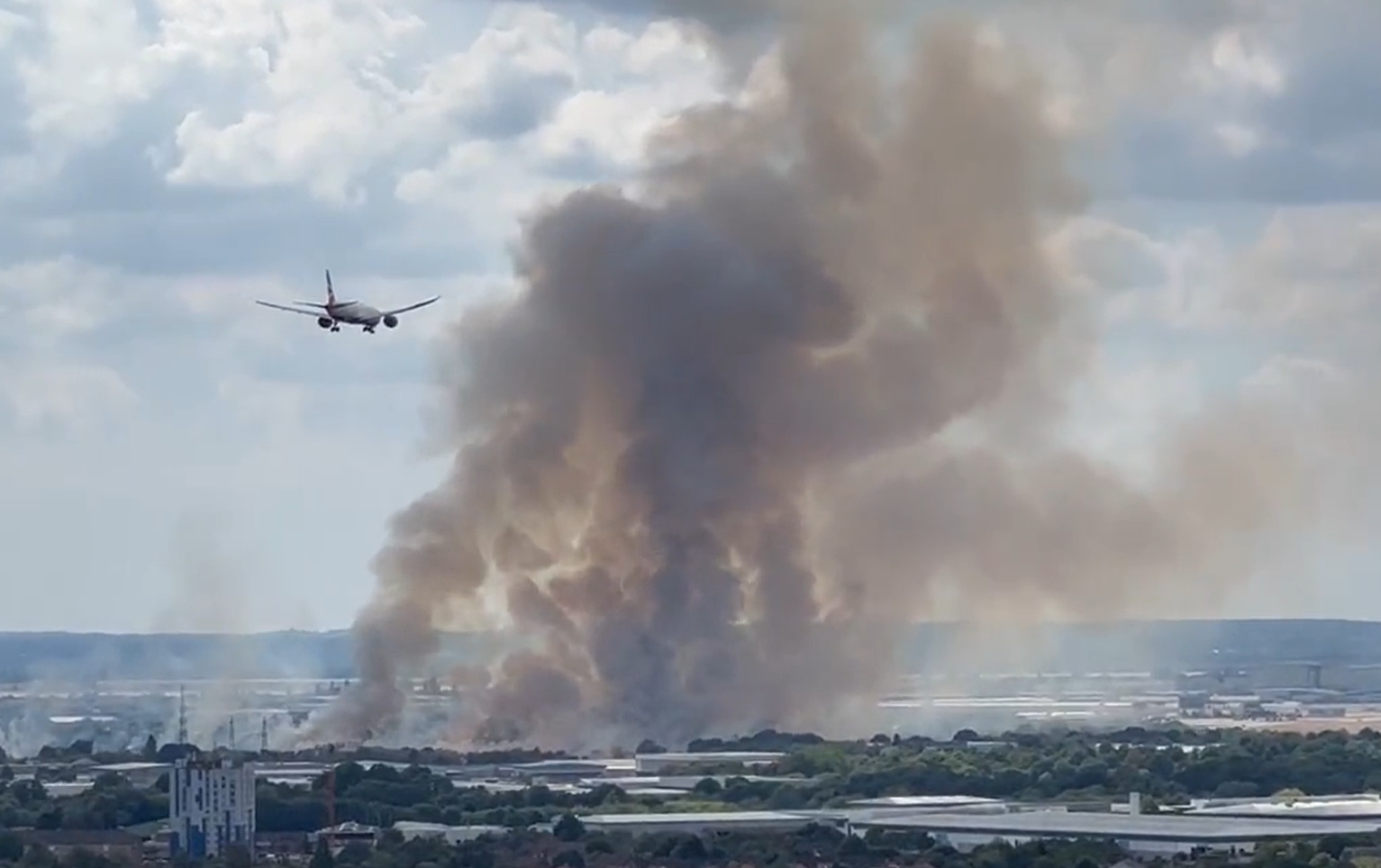 Around six hectares of land are alight and producing a large amount of smoke, the London Fire Brigade