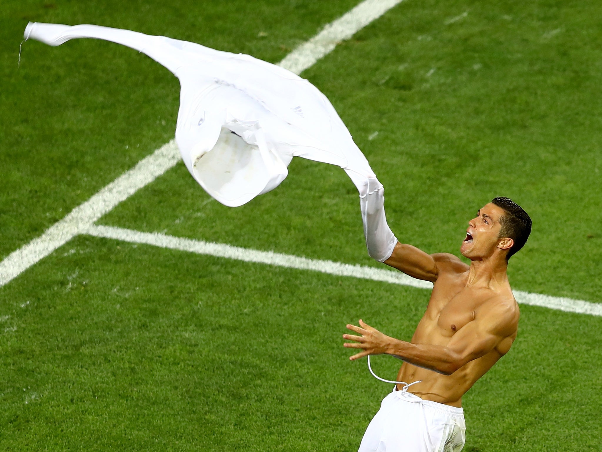 Cristiano Ronaldo takes off his shirt after scoring a winning penalty at the UEFA Champions League Final match in 2016