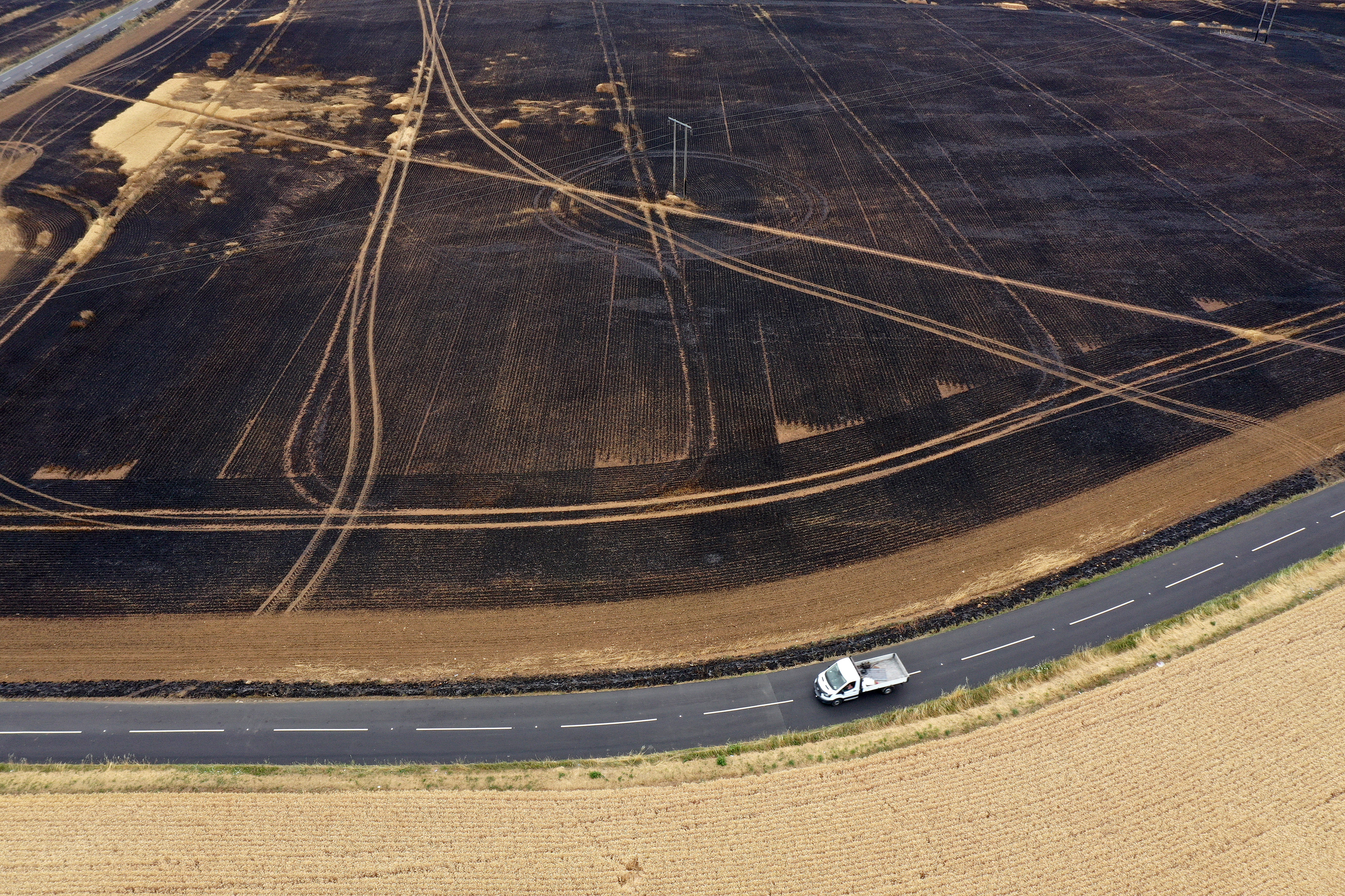 An aerial view of charred fields after a crop fire near the village of Dinnington on July 20, 2022 in Rotherham, United Kingdom.