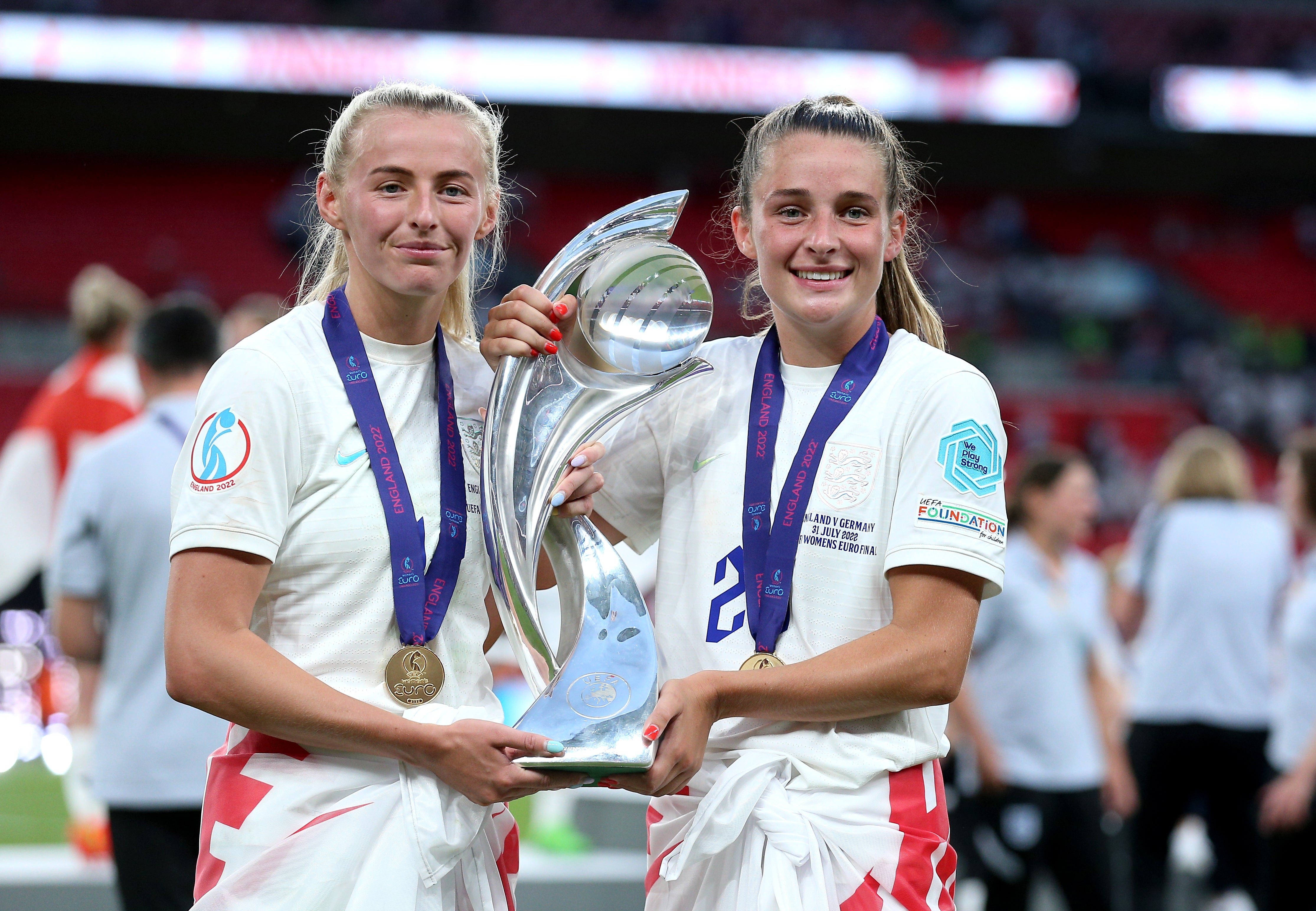 Ella Toone, right, and Chloe Kelly, England’s goalscorers in the Euro 2022 final, celebrate with the trophy (Nigel French/PA)