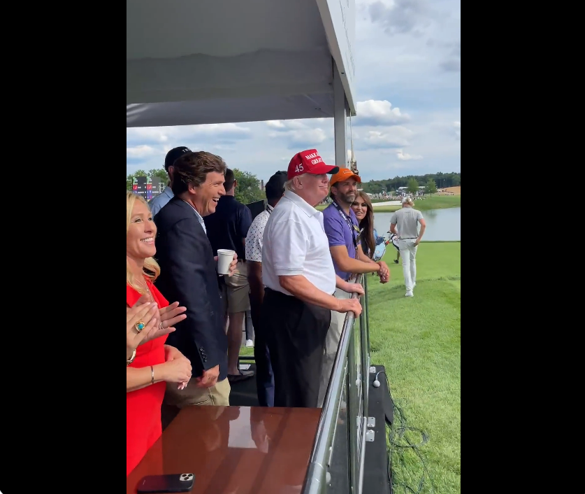 Congresswoman Marjorie Taylor Greene, Donald Trump, Tucker Carlson and Donald Trump Jr stand in front of a crowd at the LIV Golf event at Trump’s Bedminster Golf Club in New Jersey over the weekend