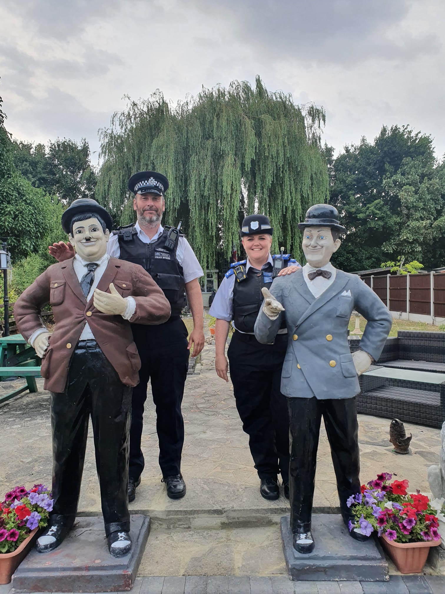 Sergeant Richard Ruane and PCSO Natalie Parrott with the Laurel and Hardy statues (Lesley Haylett/PA)