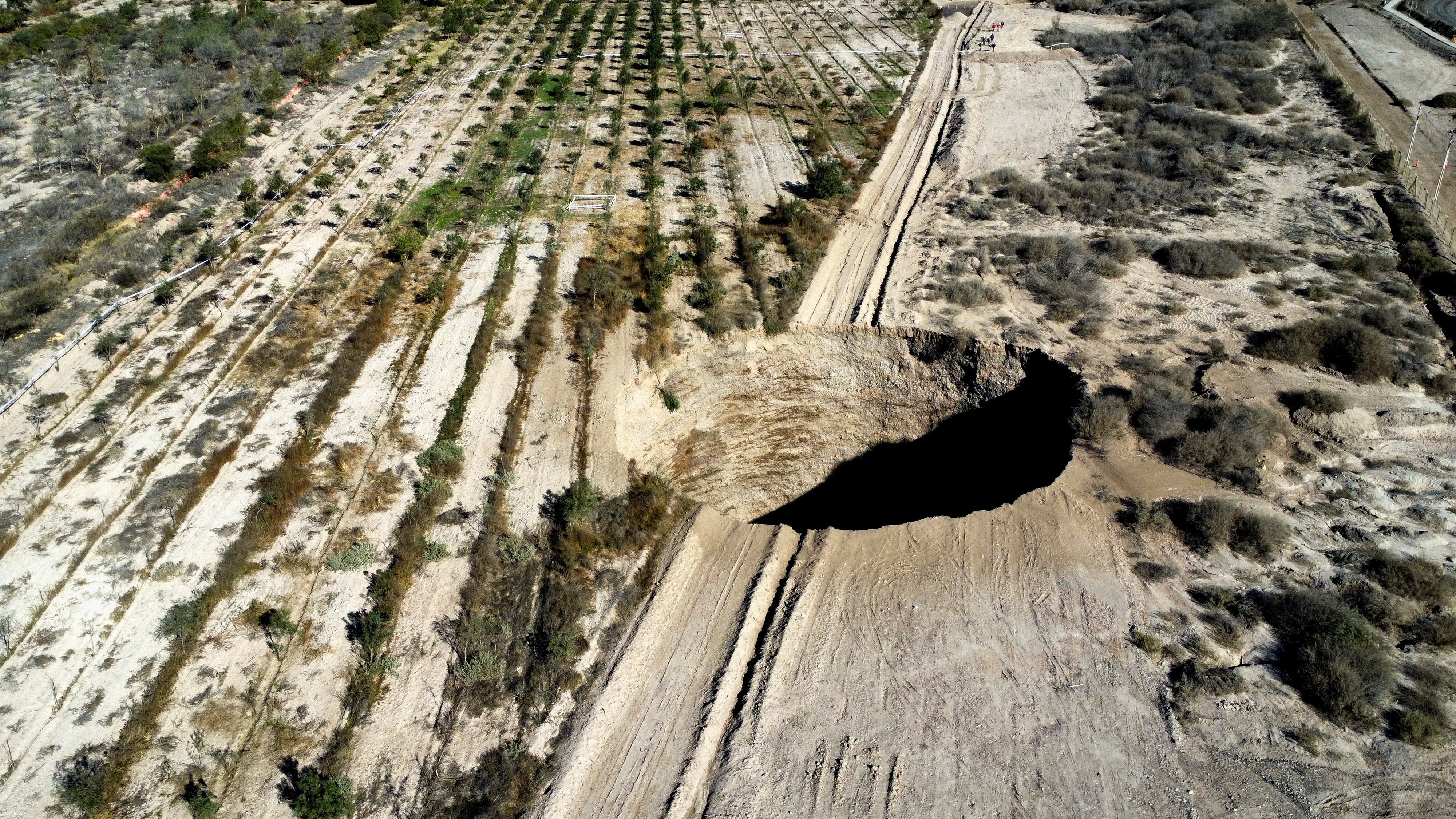 The huge hole opened up in a field near the Lundin Mining operation