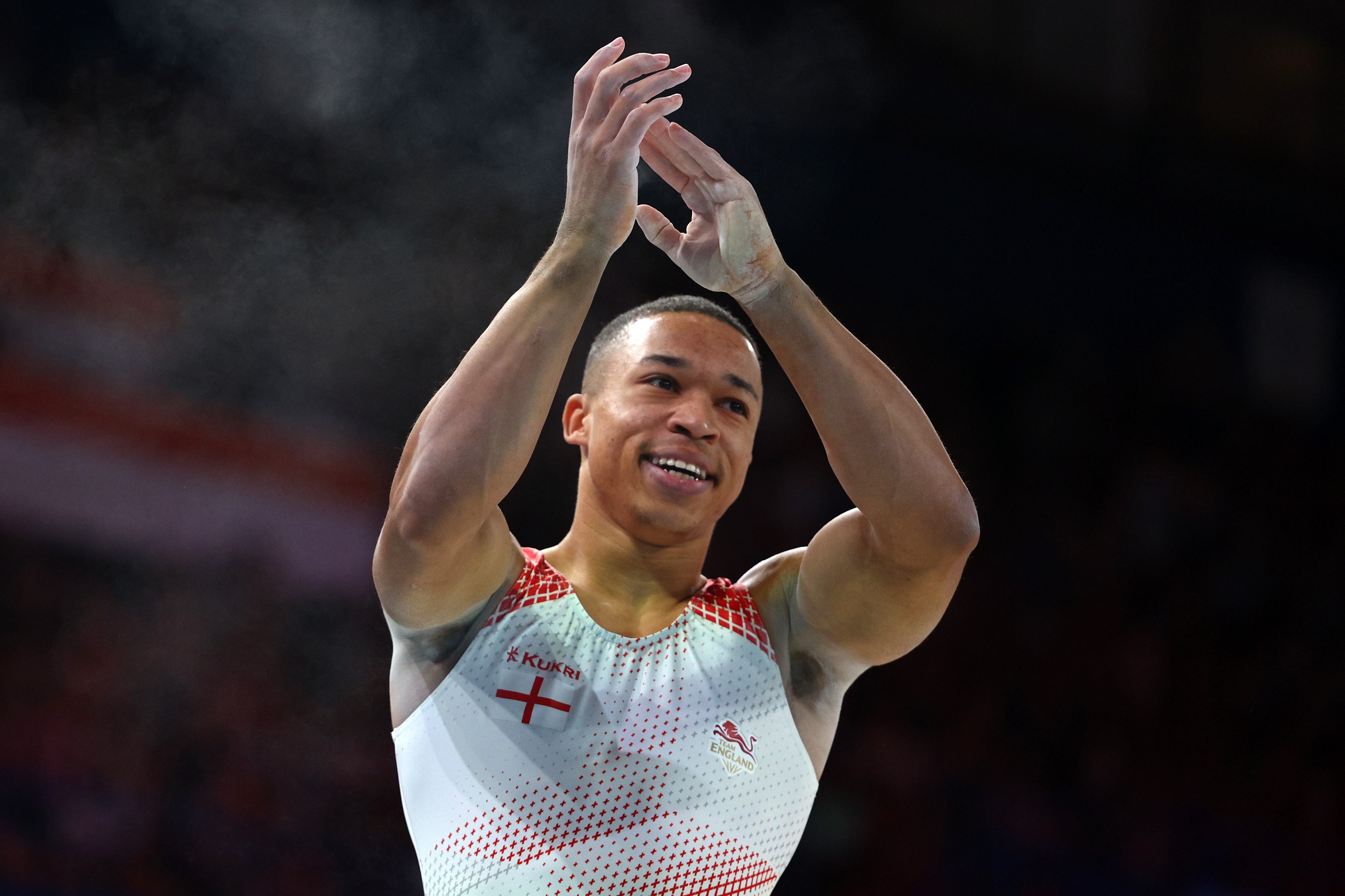 Joe Fraser of Team England celebrates after their routine during Men's Pommel Horse Final