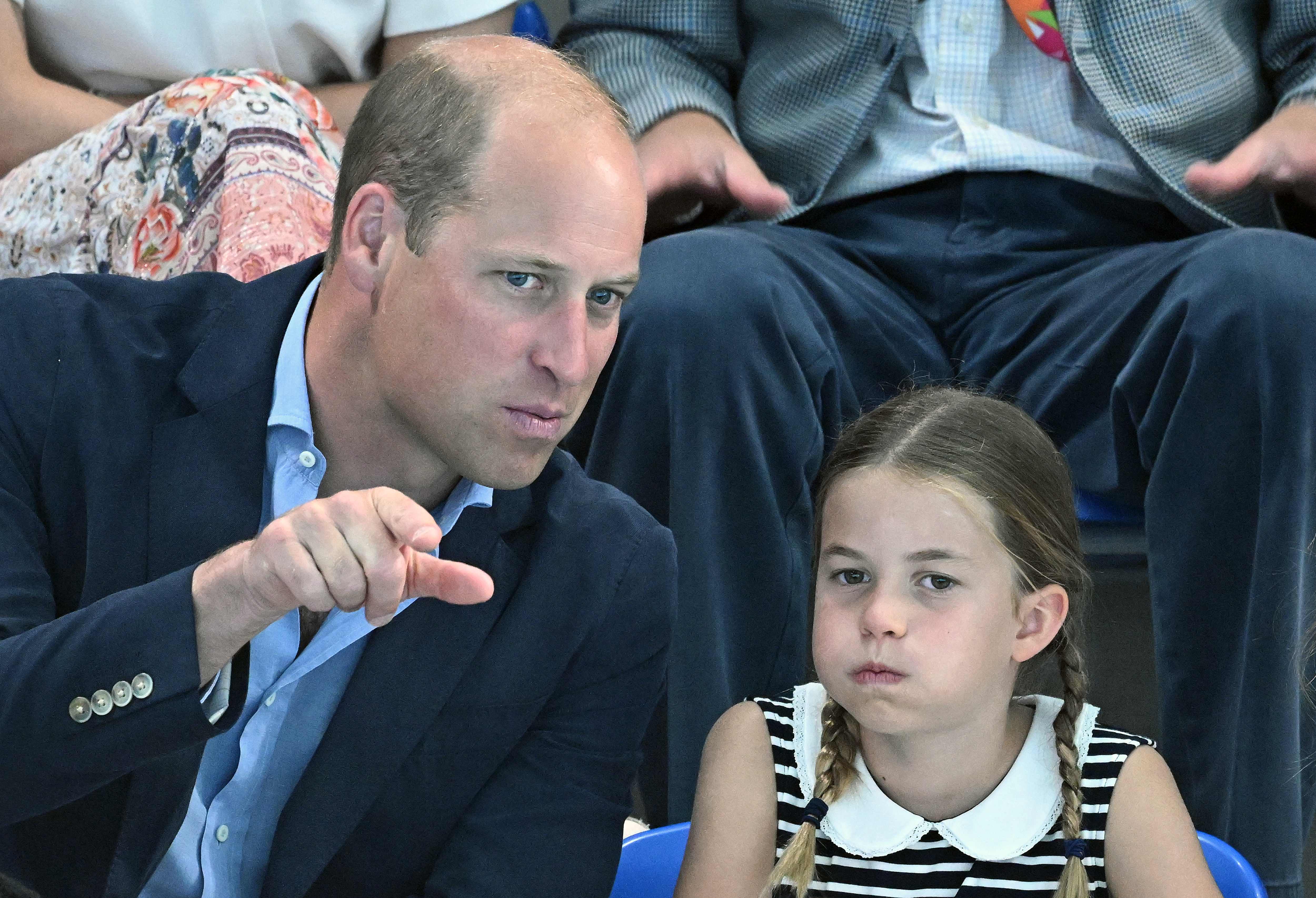 Princess Charlotte of Cambridge and Prince William, Duke of Cambridge watch the men’s 1500m freestyle heats swimming event at the Sandwell Aquatics Centre