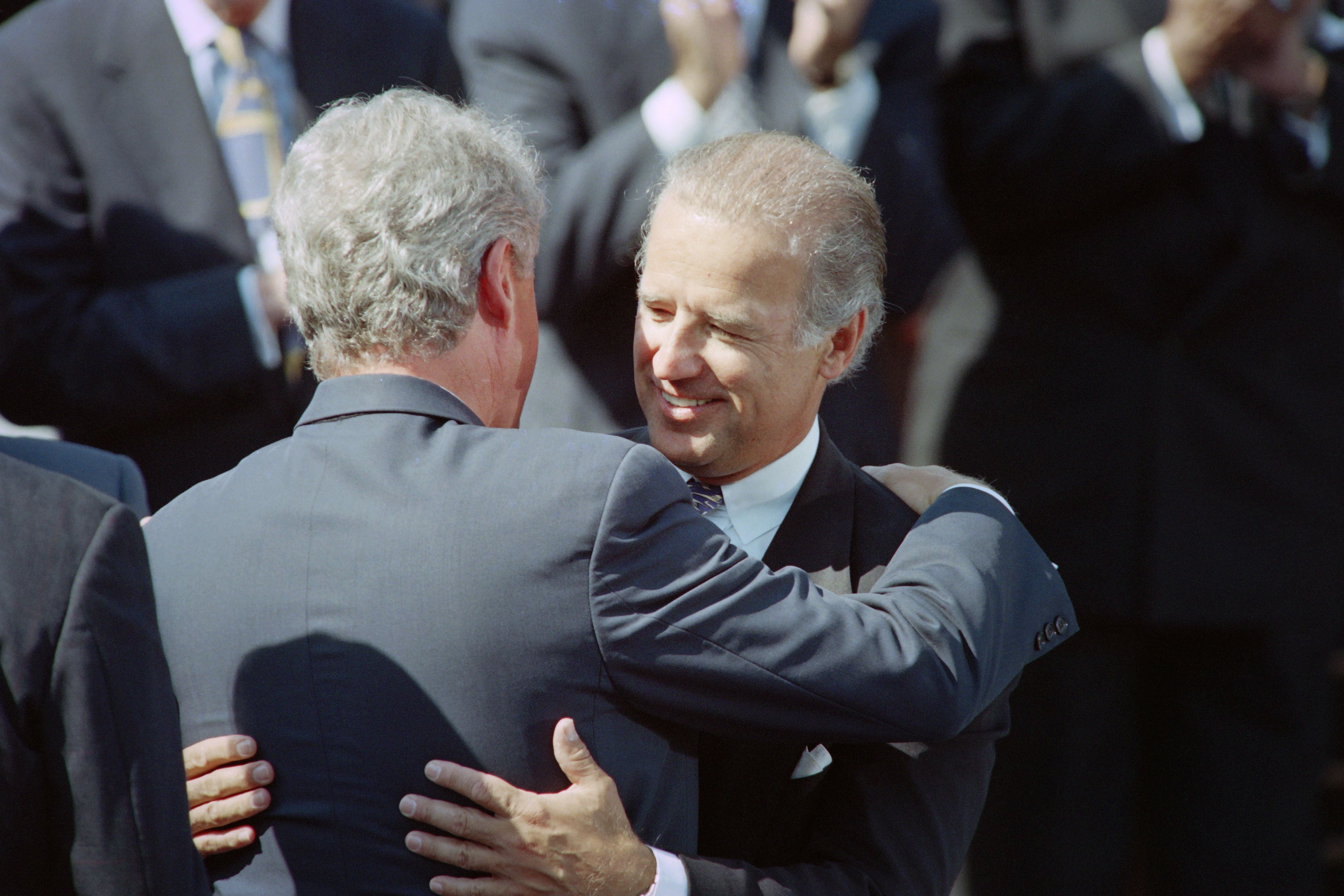 Then-Senator Joe Biden hugs then-President Bill Clinton during a signing ceremony for the 1994 crime bill.