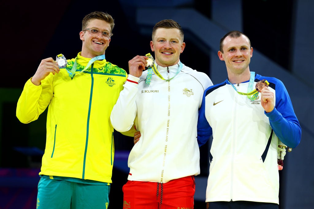 Adam Peaty alongside Sam Williamson and Ross Murdoch