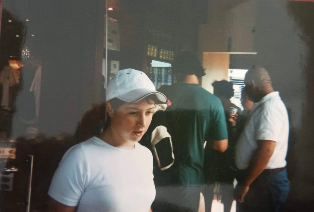 Rosie Myers wearing a baseball cap as a child to hide her bald spots (Collect/PA Real Life)