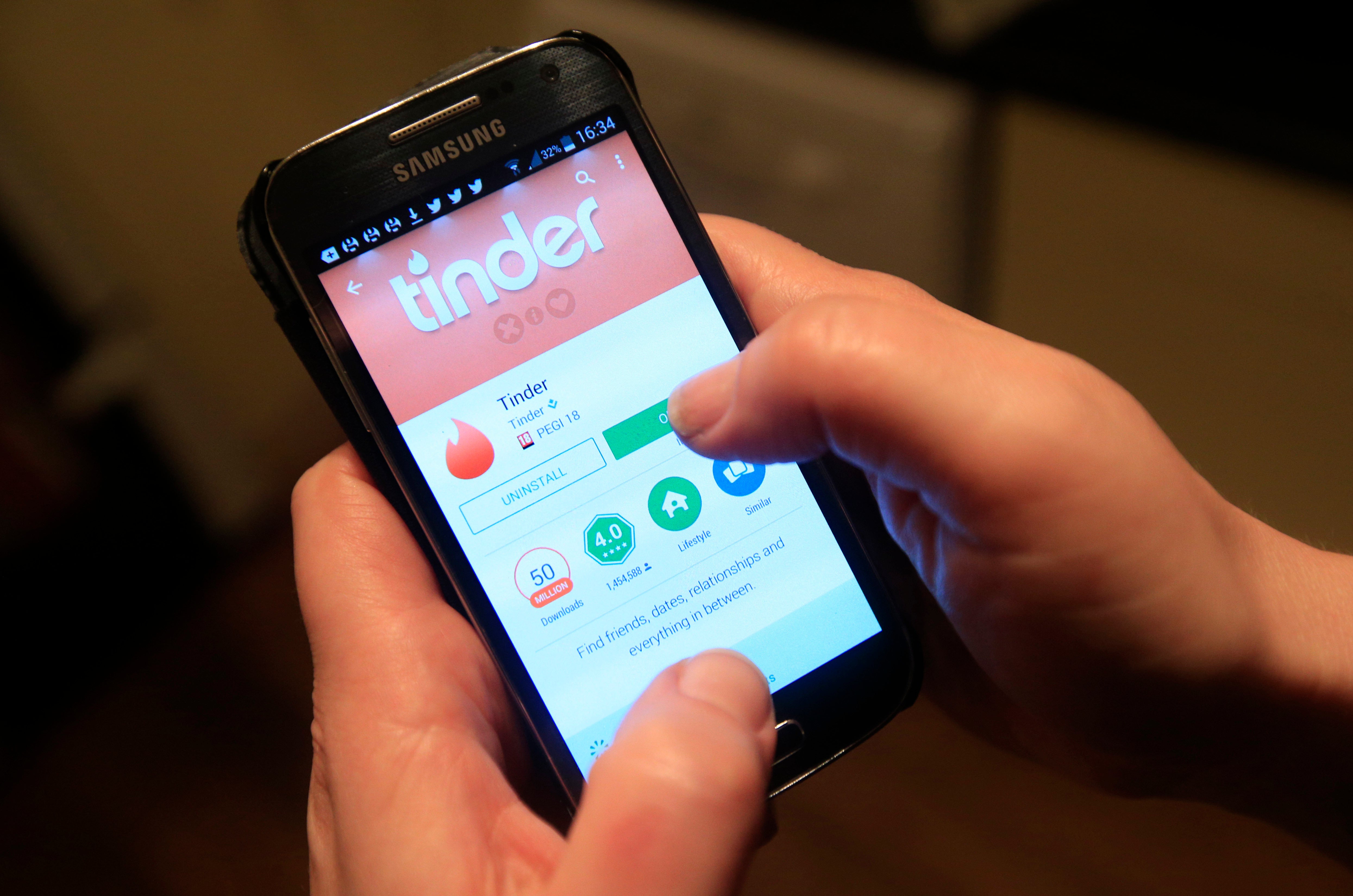 The Tinder app in use on a Samsung smartphone.