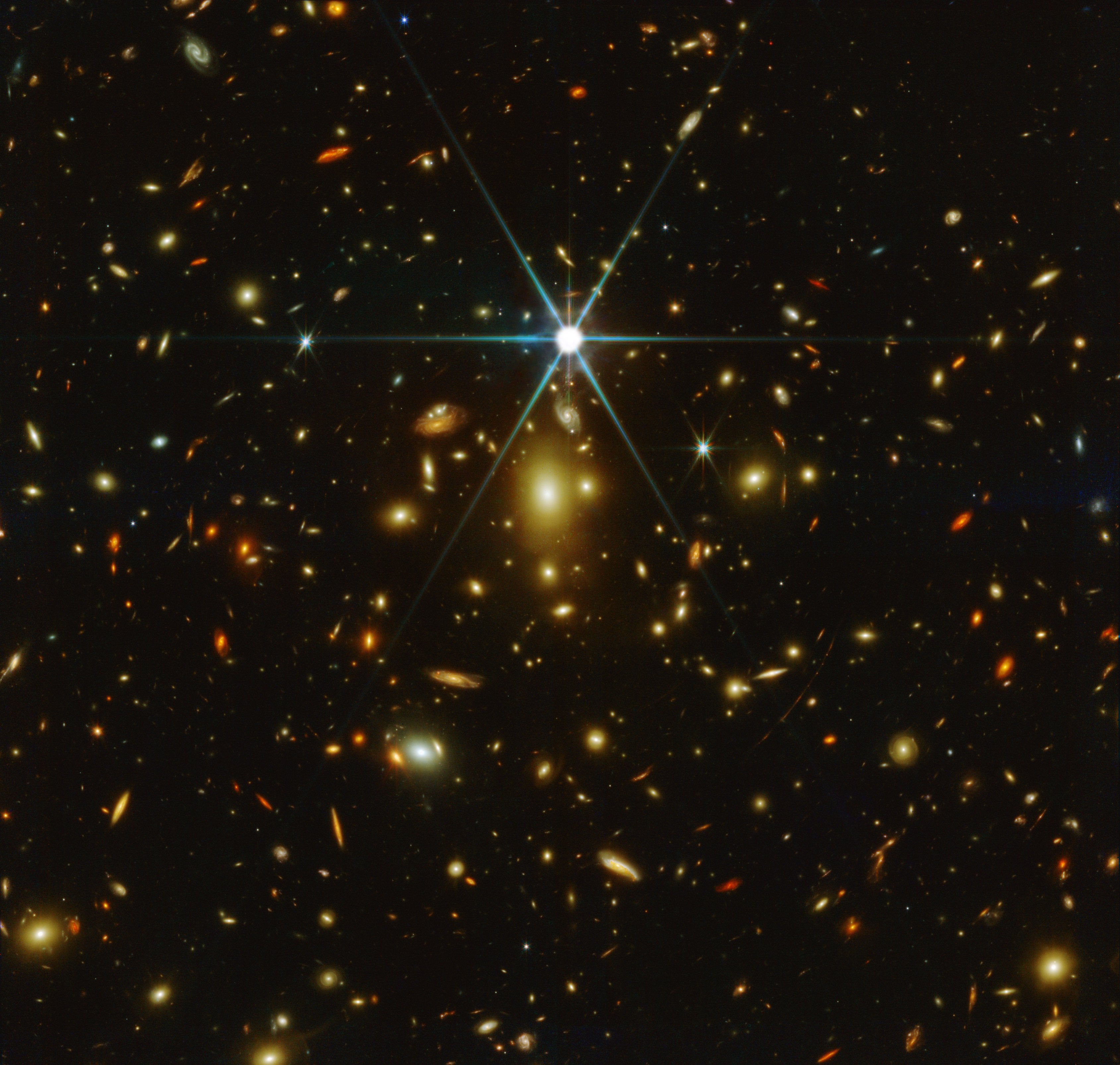 The first JWST image of Earendel, the most distant star known in our universe, lensed and magnified by a massive galaxy cluster.