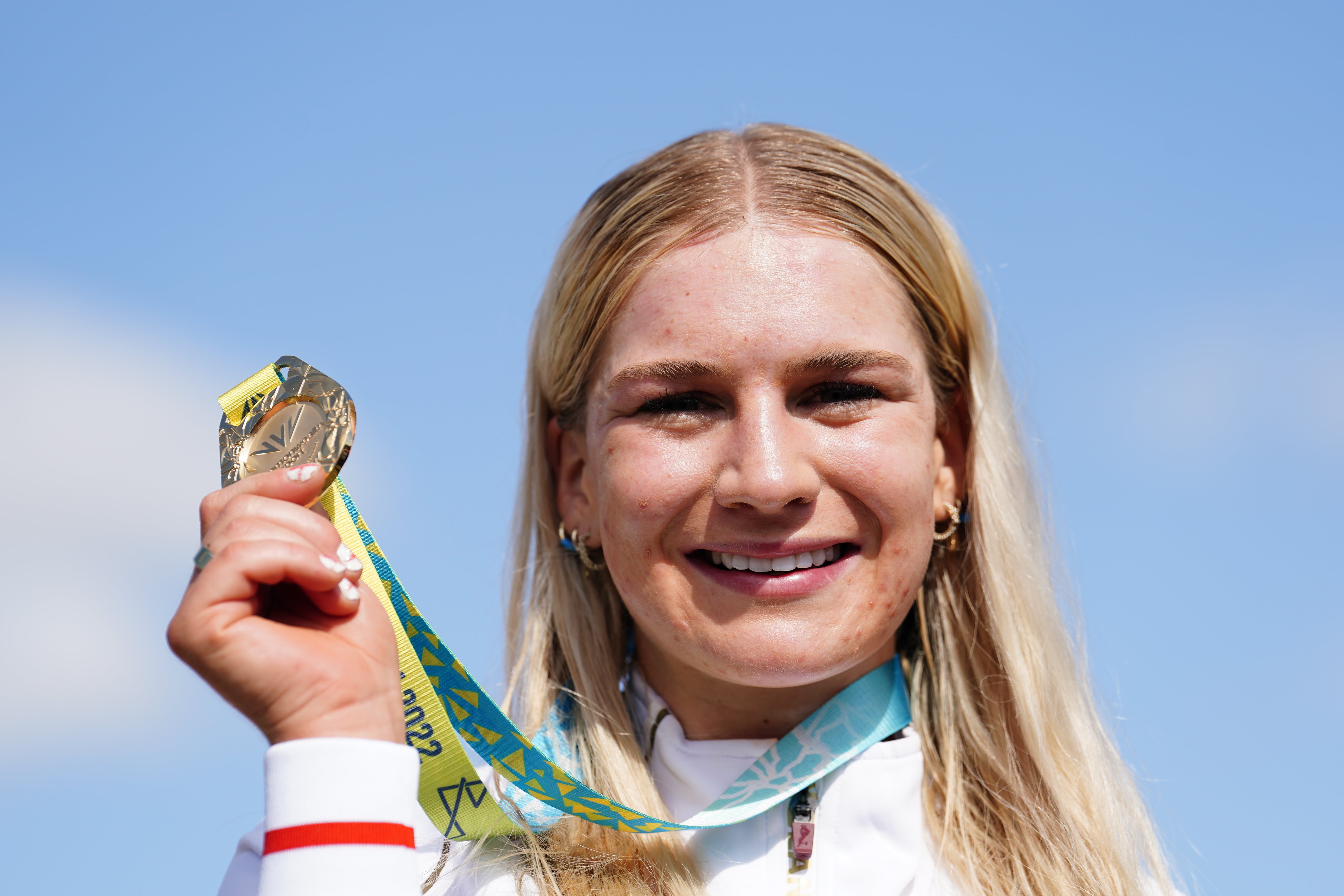 Evie Richards celebrates with her gold medal in Cannock Chase (David Davies/PA)