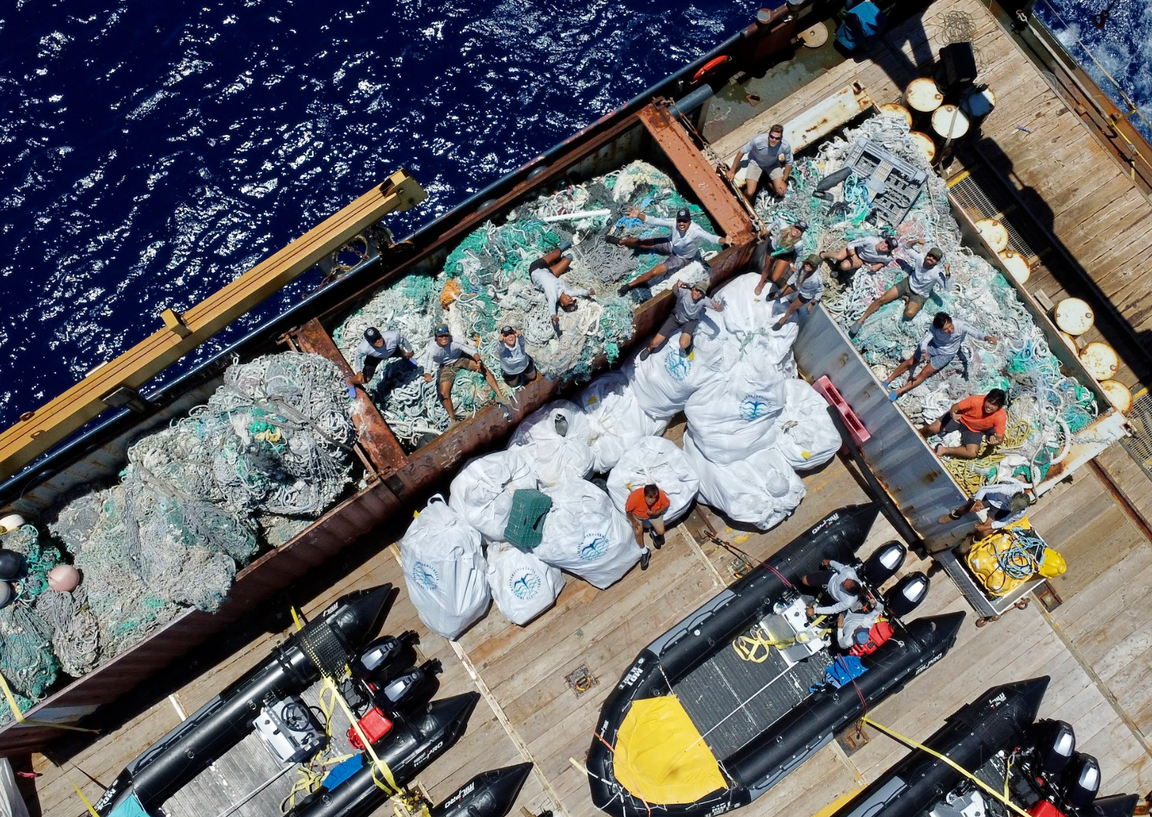 The PMDP team poses with 97,295 pounds of marine debris removed from the Papahānaumokuākea Marine National Monument outside of Monument boundaries (outside of Kauaʻi Island)