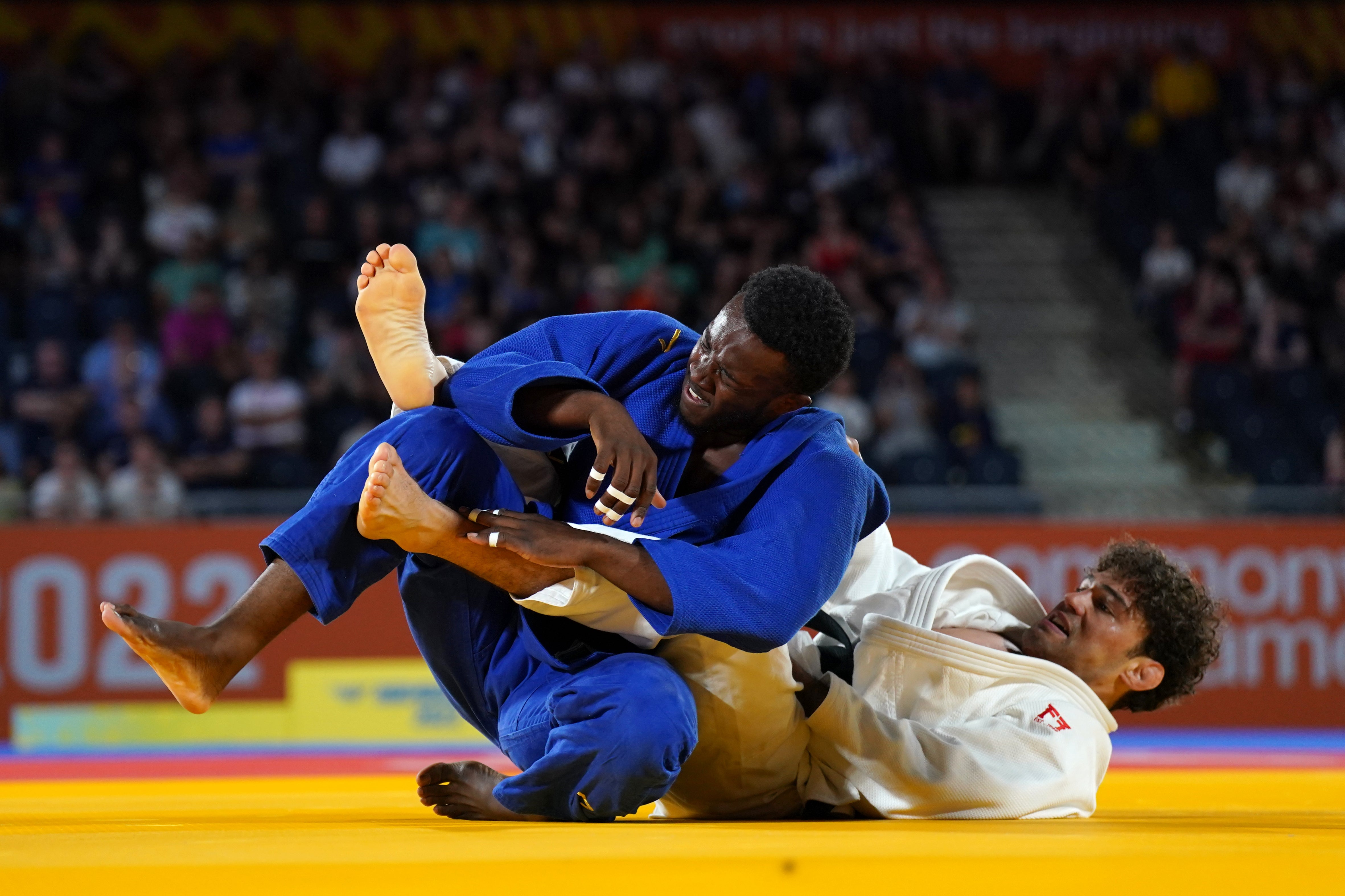 Jamal Petgrave (blue) and Mauritius’ Remi Feuillet in action in their judo men’s -90kg final (Joe Giddens/PA)