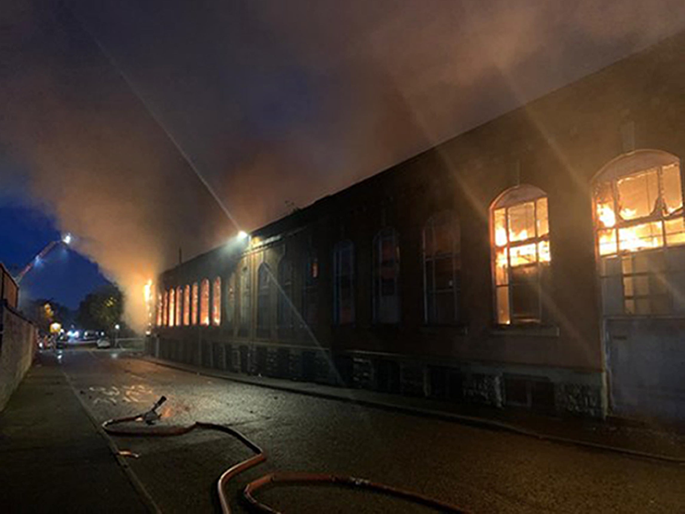 A third body has been found at the scene of a huge blaze at a warehouse in Oldham