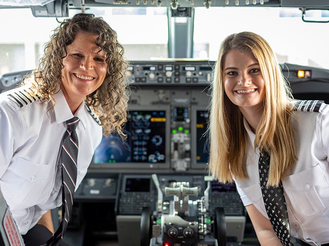 Captain Holly Petitt [L] and First Officer Keely Petitt [R] on their first flight together as pilots