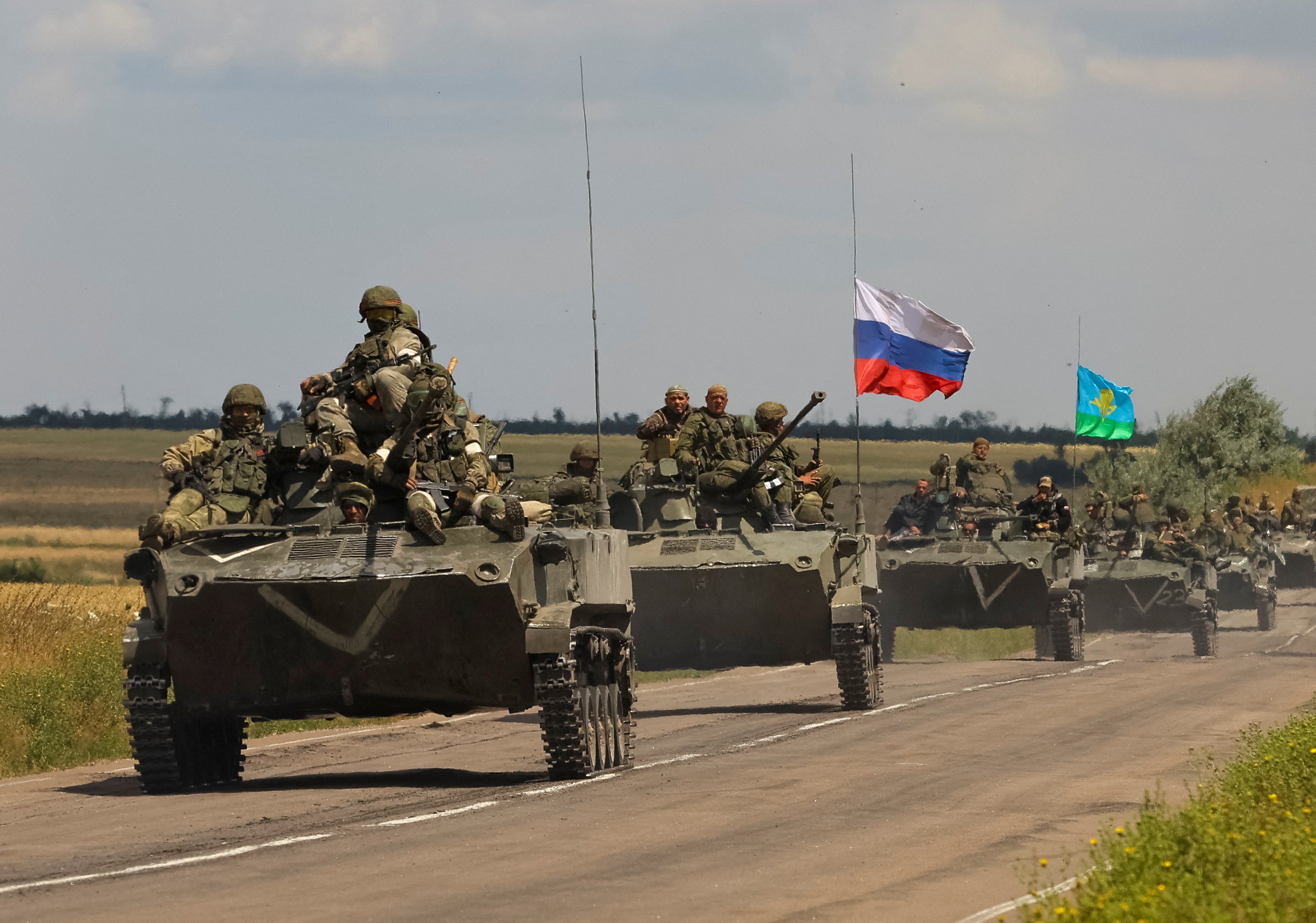 An armoured convoy of Russian troops drives in a Russian-held part of Zaporizhzhia region