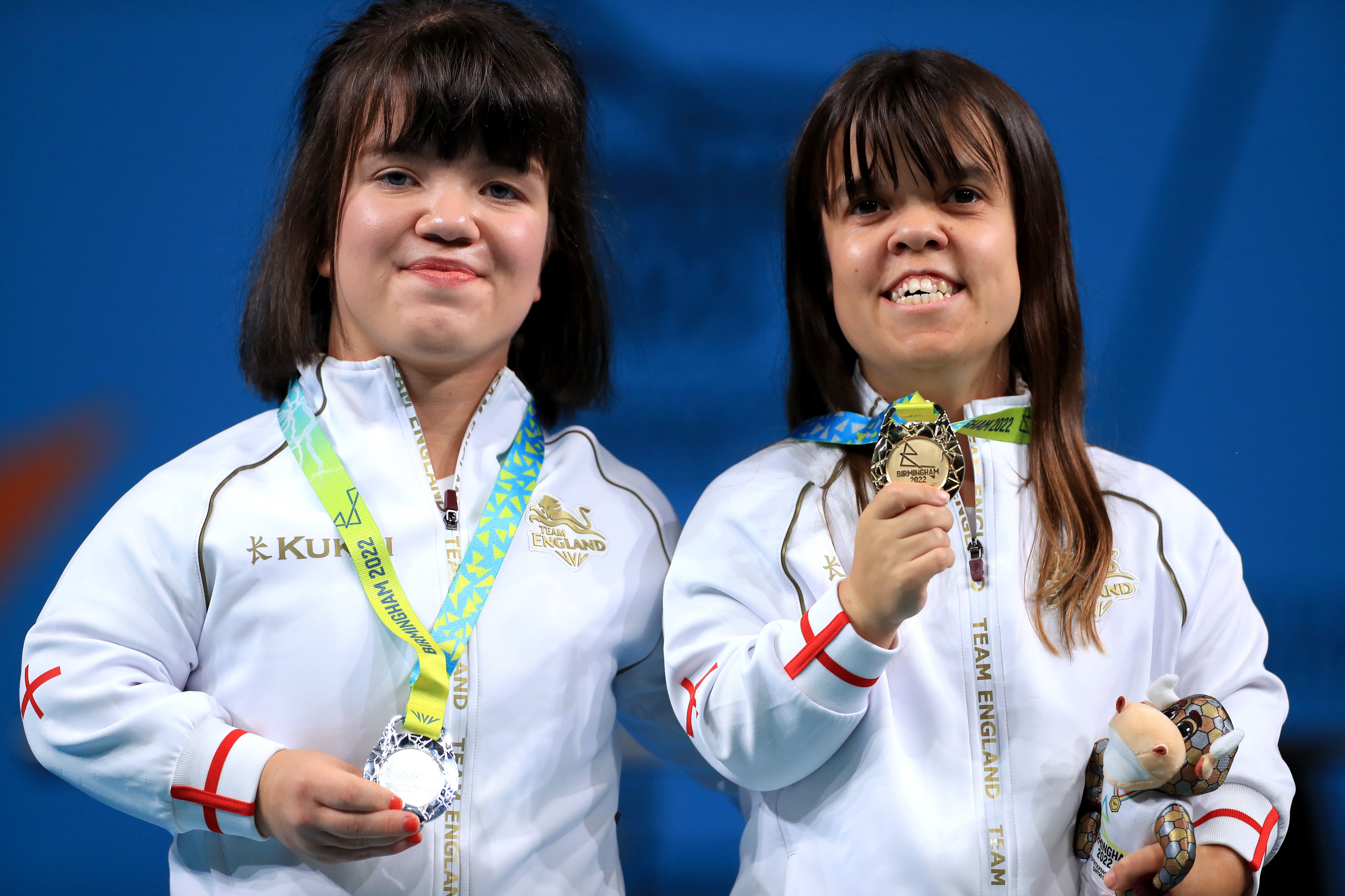 Zoe Newson (right) celebrates her para powerlifting gold medal with silver medallist and England teammate Olivia Broome (right) at the 2022 Commonwealth Games (Bradley Collyer/PA)