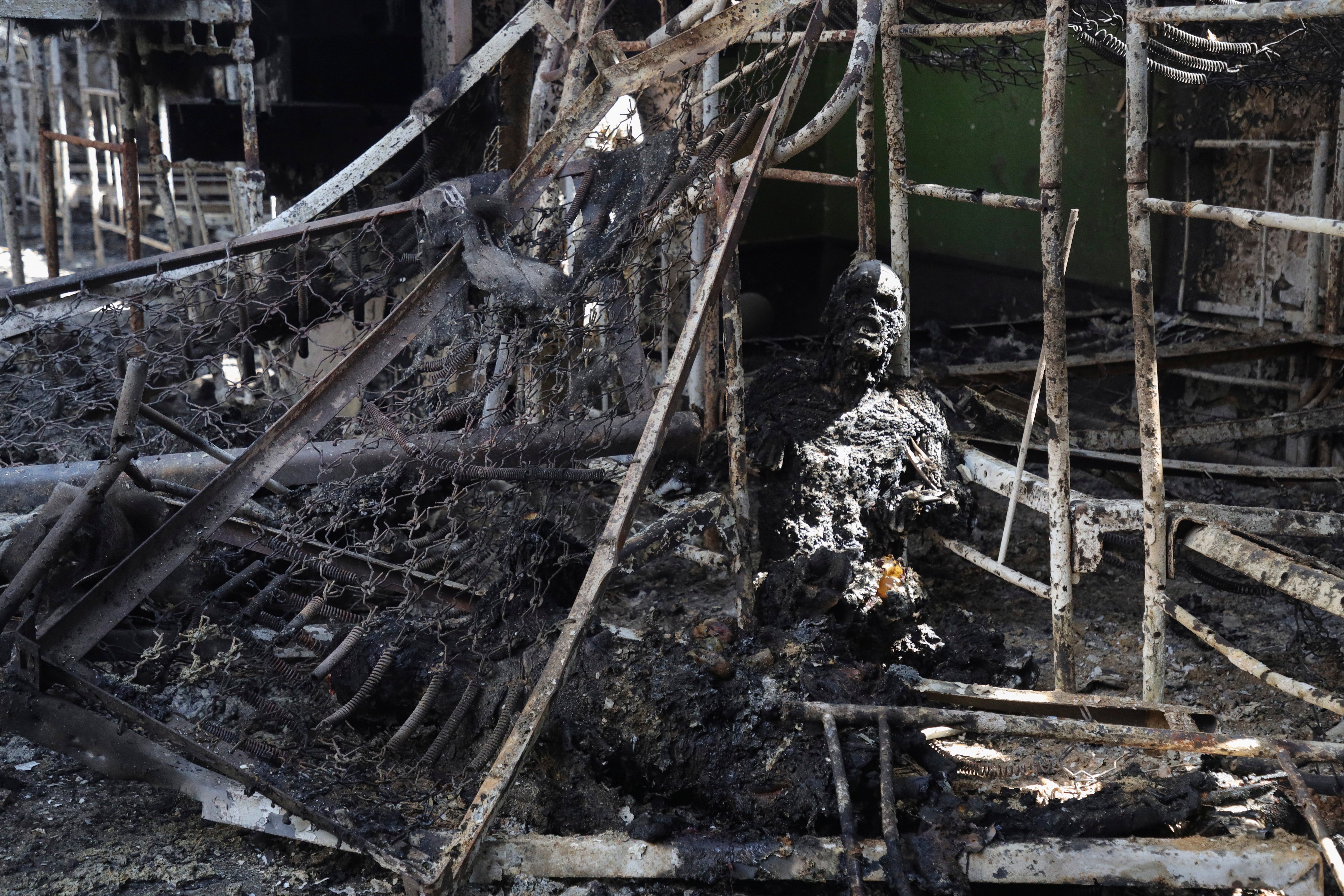 The destroyed remains of the building in Olenivka