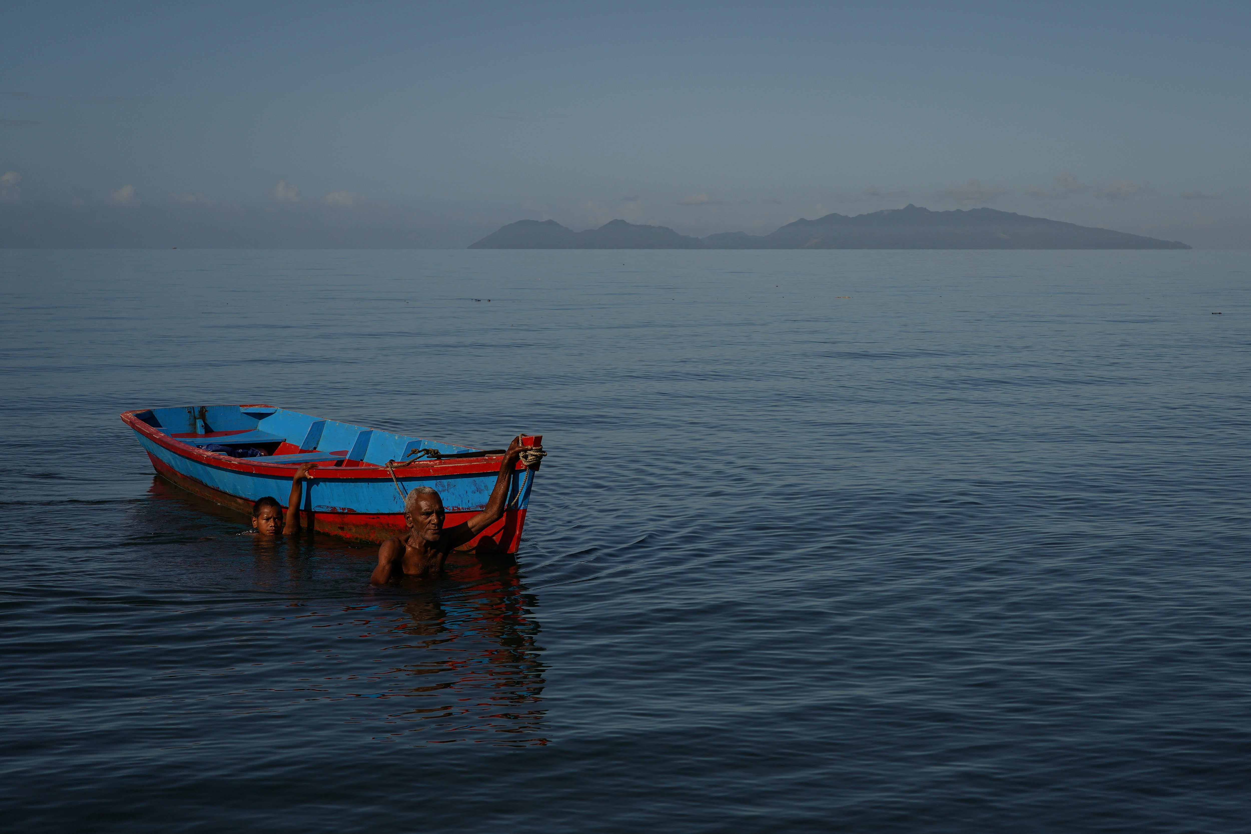 Roemoni Tubivuna and his grandson Roemoni Tubivuna Jr, 10, prepare for a fishing outing at Veivatuloa village