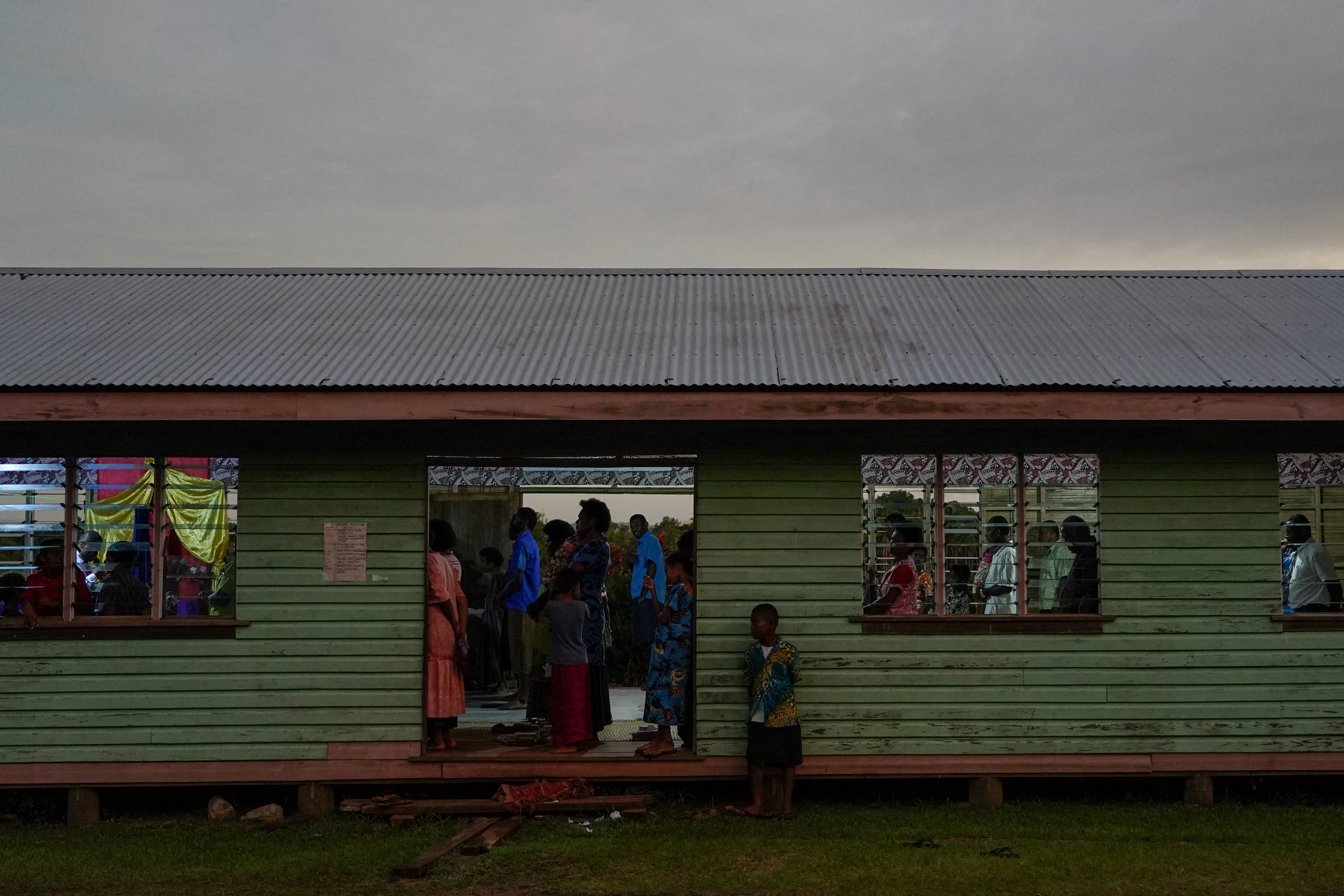 Community members gather for a Sunday church service in Vunidogoloa village