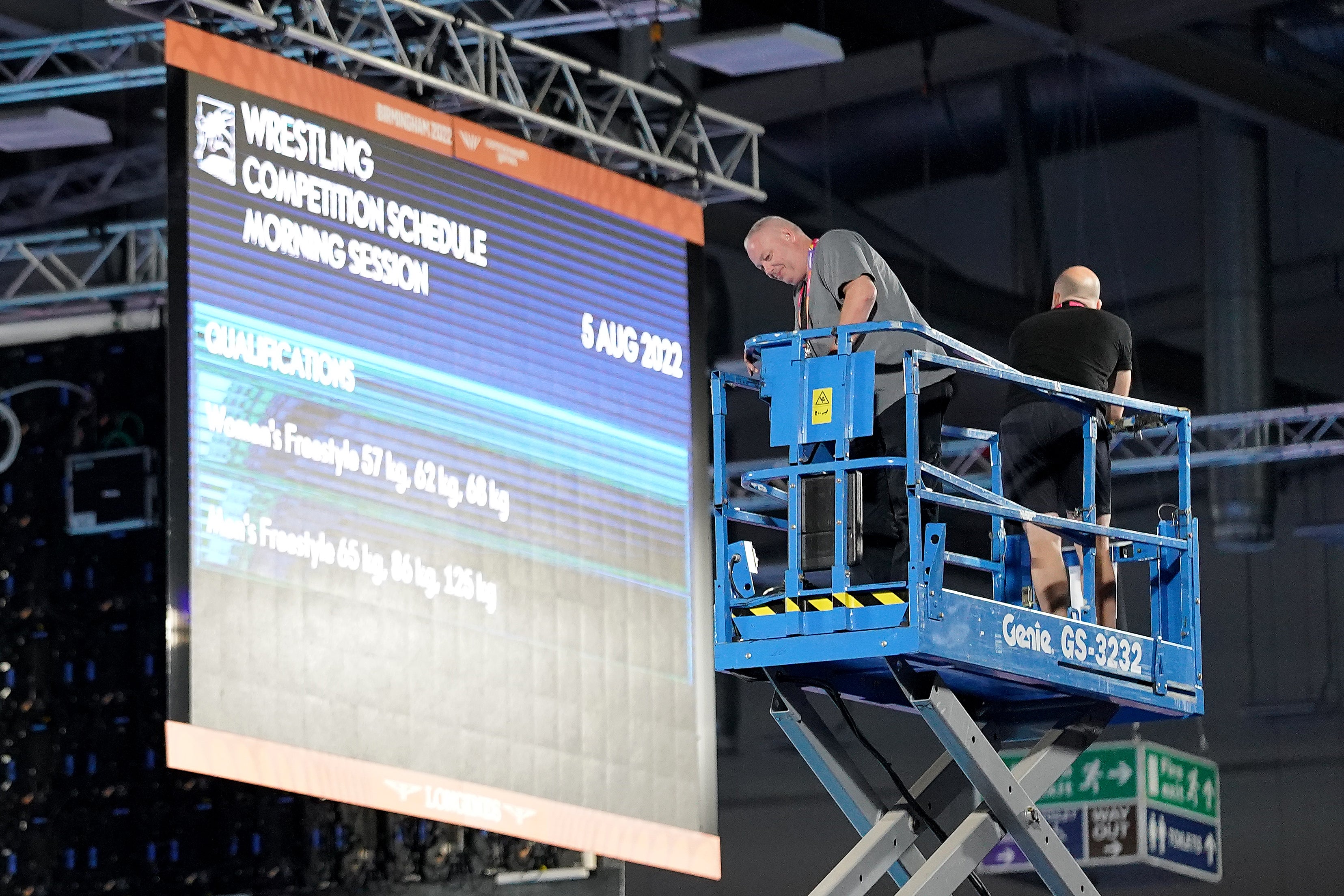 Staff carry out safety checks at the Coventry Arena after a speaker cover fell from the roof