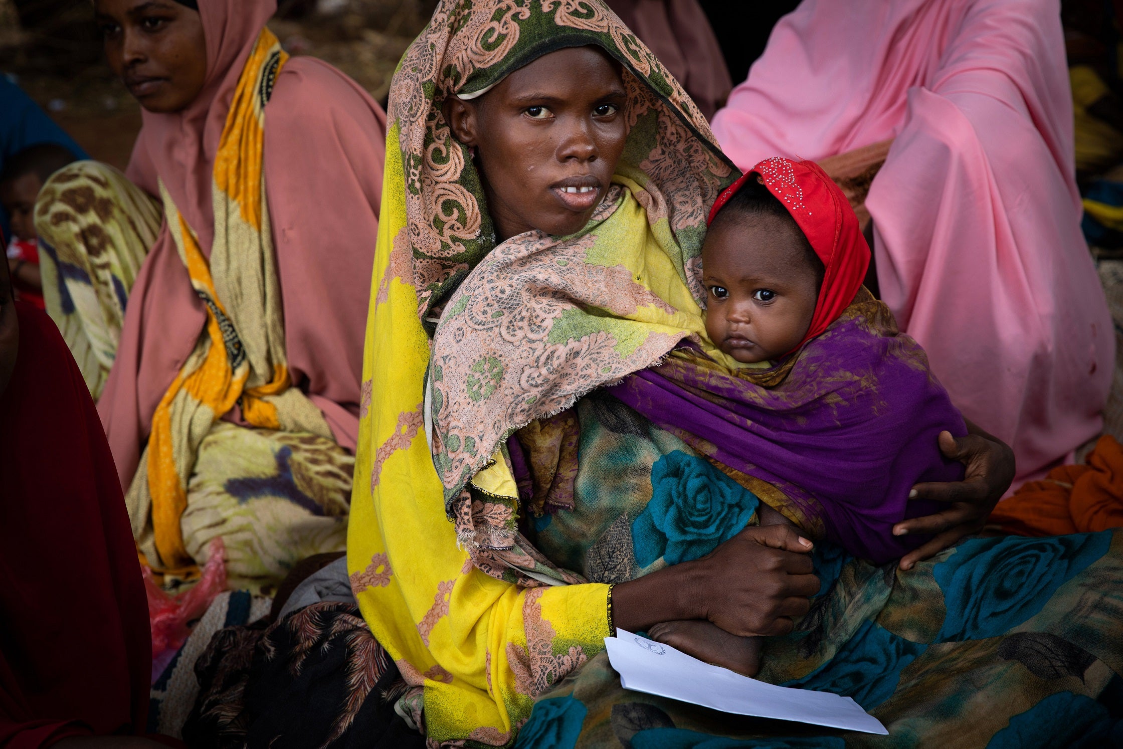 Ayan waits with her daughter Mushtaq at the Kabasa health centre