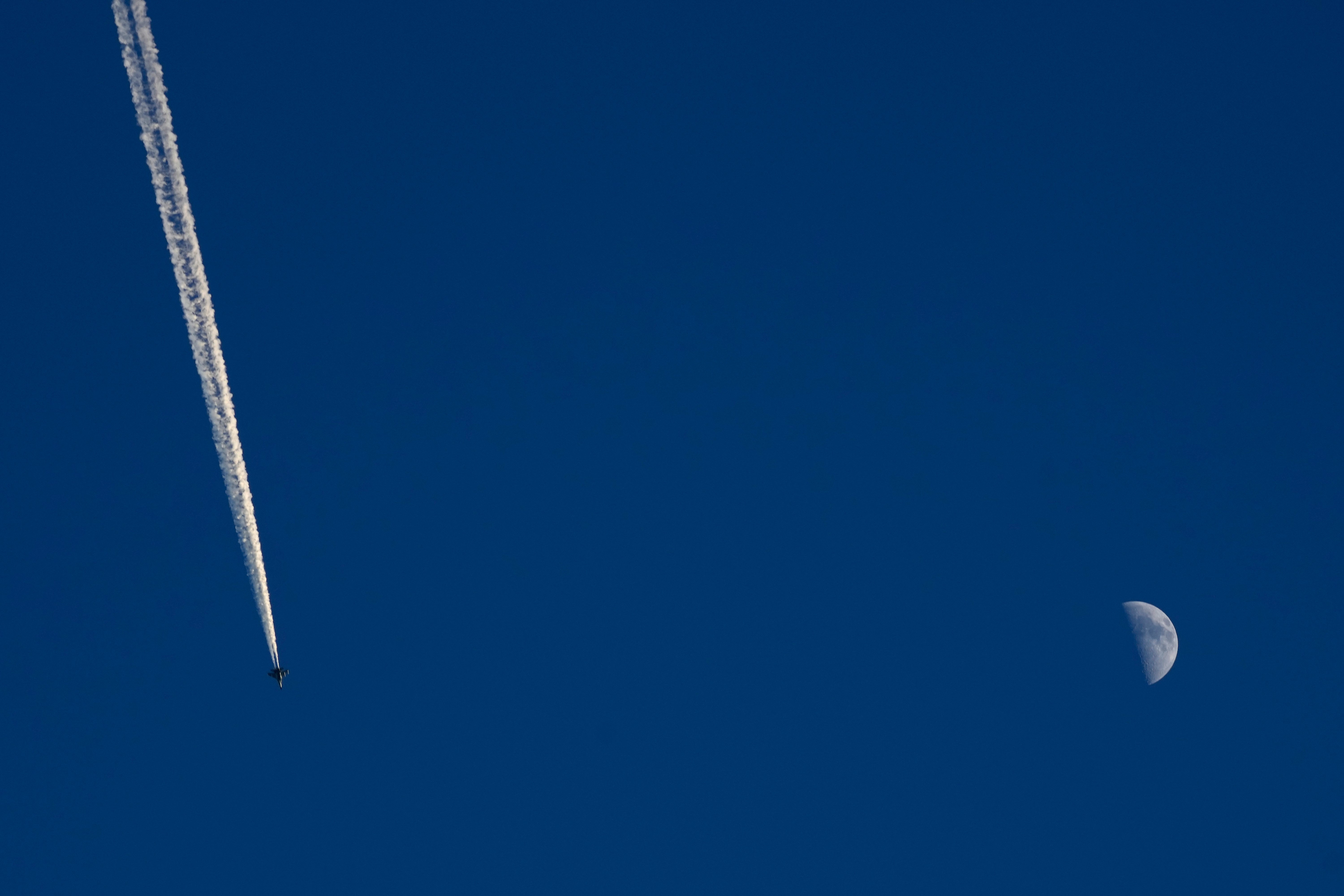 A military plane flies above the Taiwan Strait as seen from the 68-nautical-mile scenic spot, the closest point in mainland China to the island of Taiwan, in Pingtan in southeastern China's Fujian Province, Friday, Aug. 5, 2022