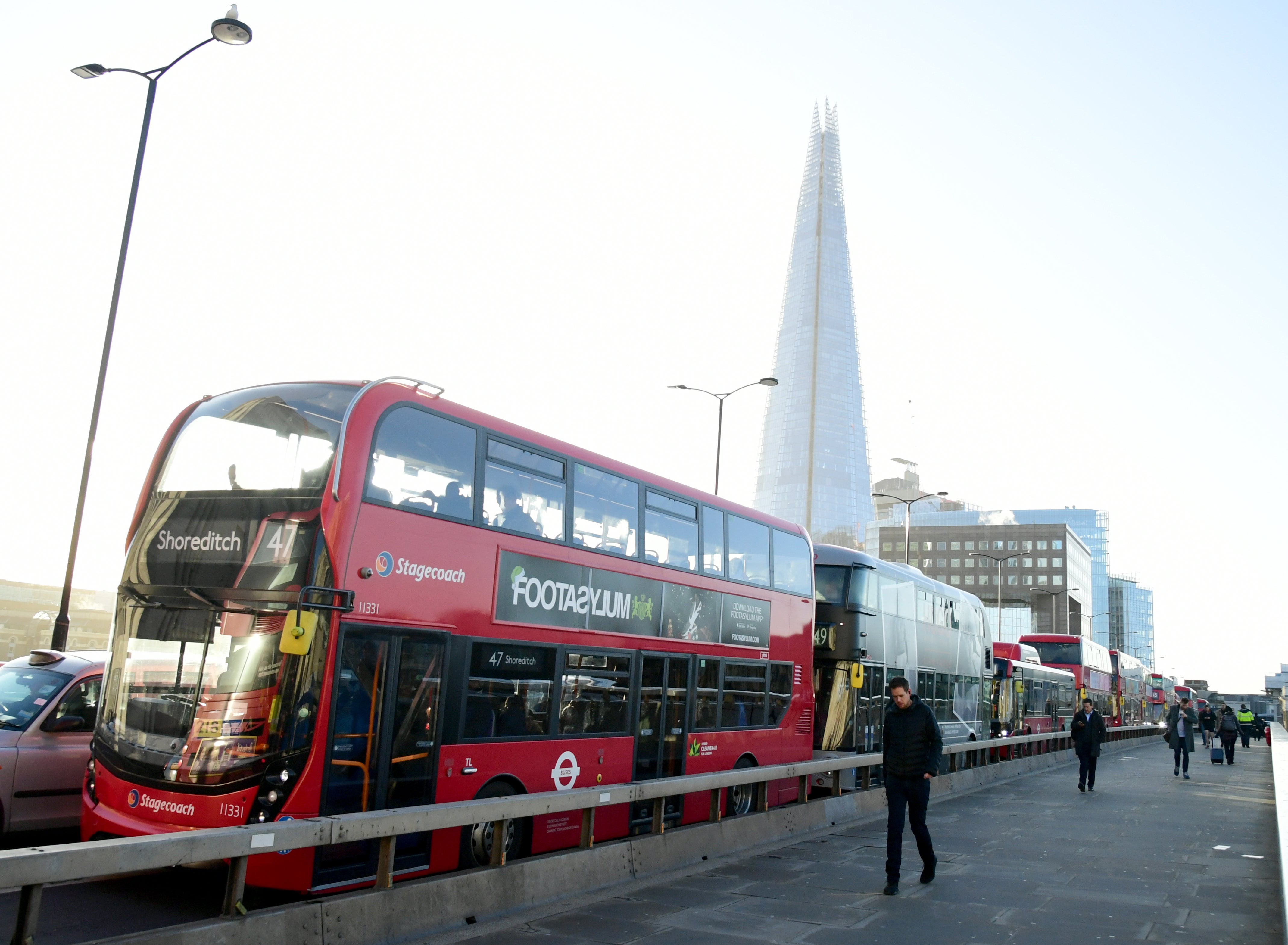 Buses on London Bridge in London (Ian West/PA)