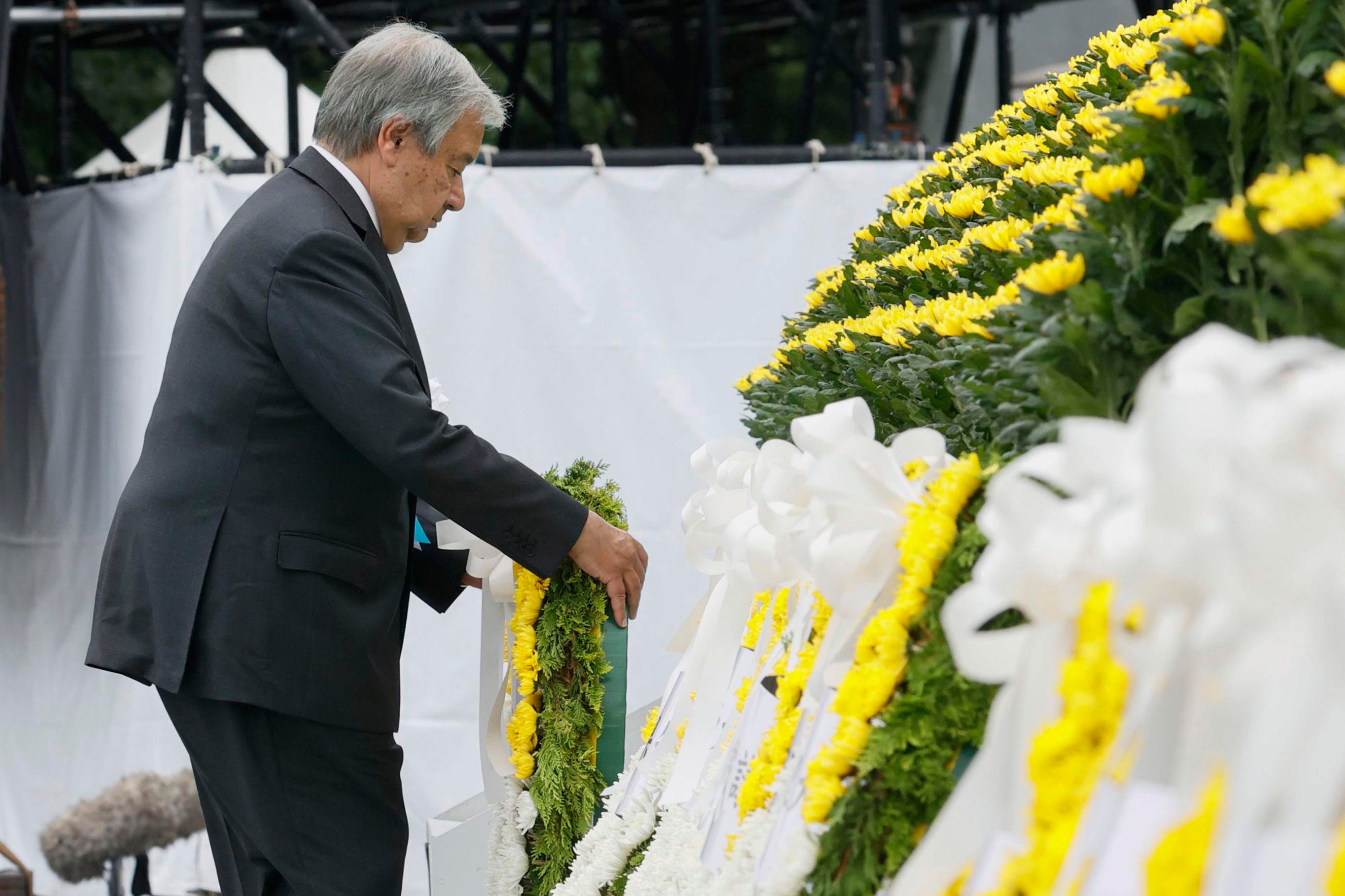 UN Secretary General Antonio Guterres lays a wreath at the cenotaph for the atomic bombing victims at the Hiroshima Peace Memorial Park during the ceremony marking the 77th anniversary of the atomic bombing in the city