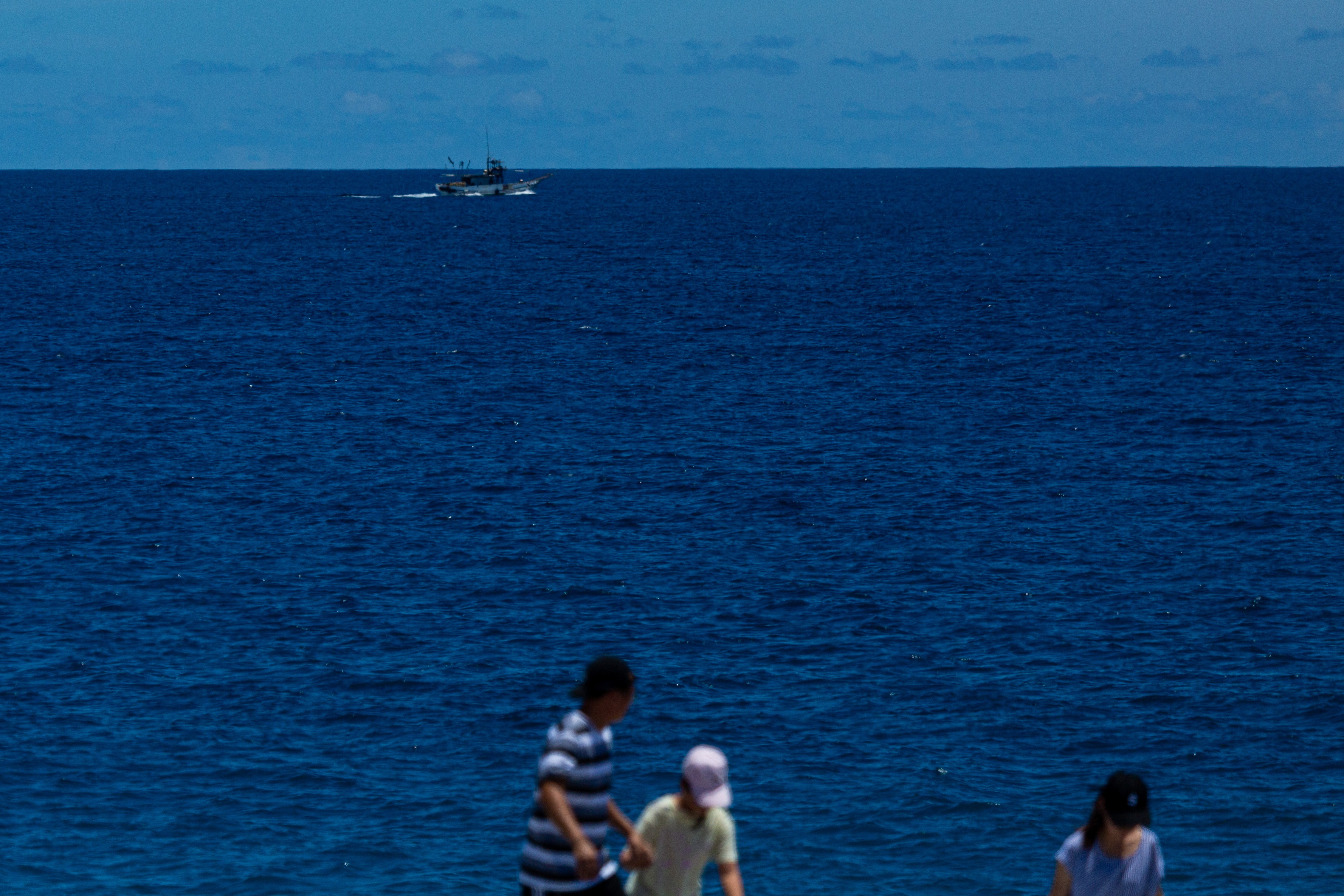 A marine vessel sails close to the coast in Hualien, Taiwan