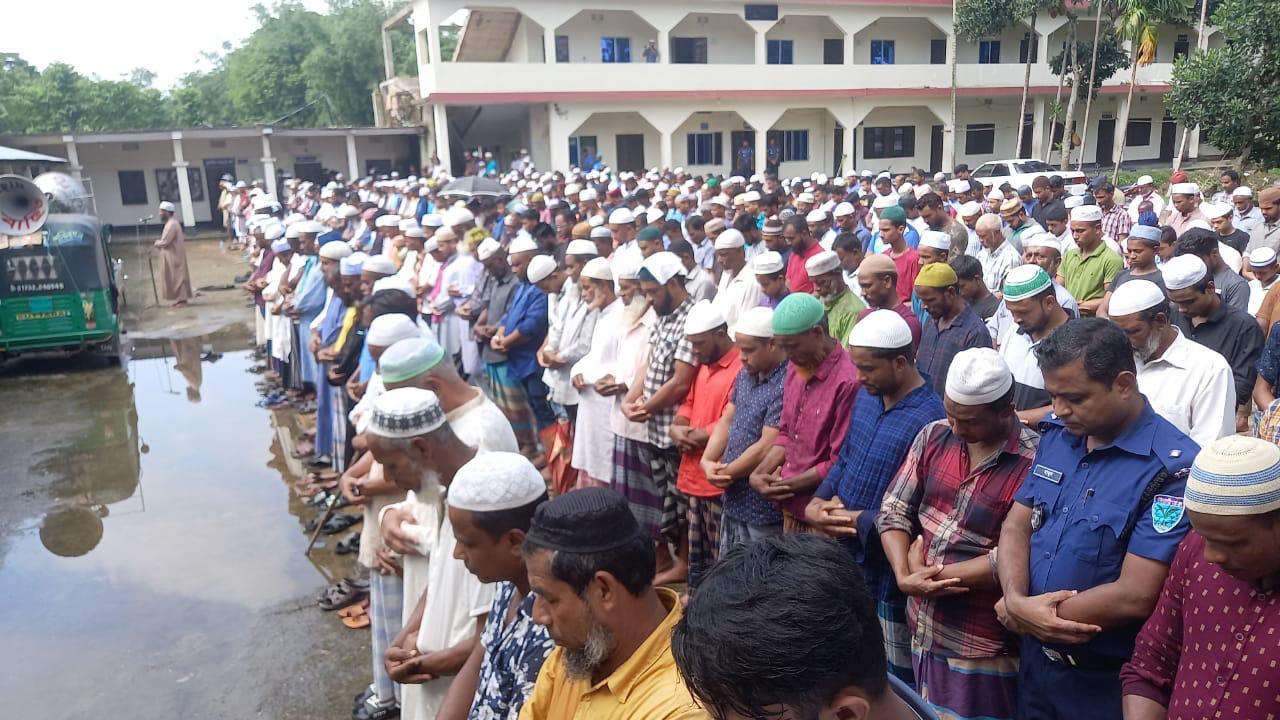 Mourners gather in Bangladesh to offer the funeral prayer for British father and son who died of suspected poisoning