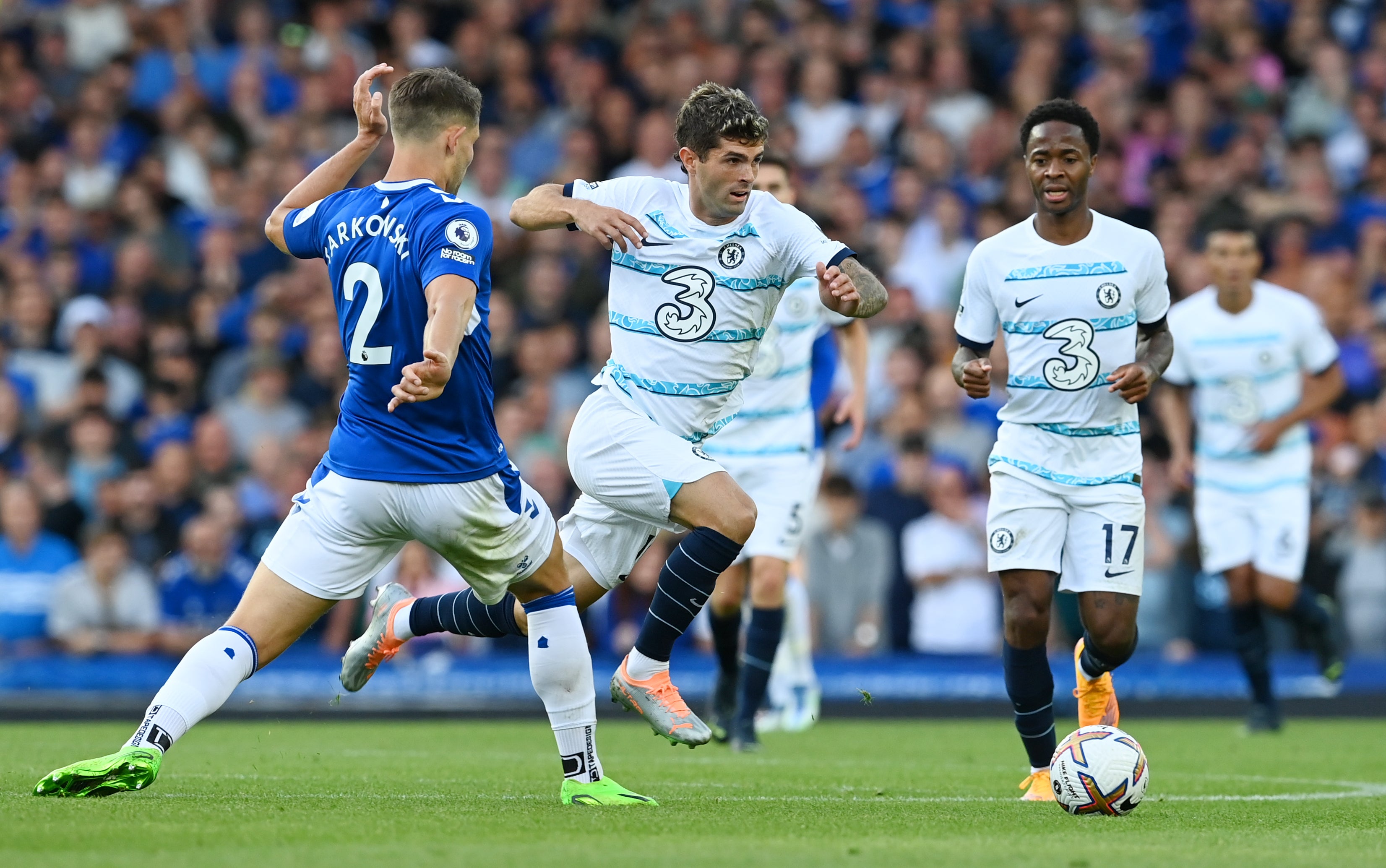 James Tarkowski, left, of Everton challenges Christian Pulisic