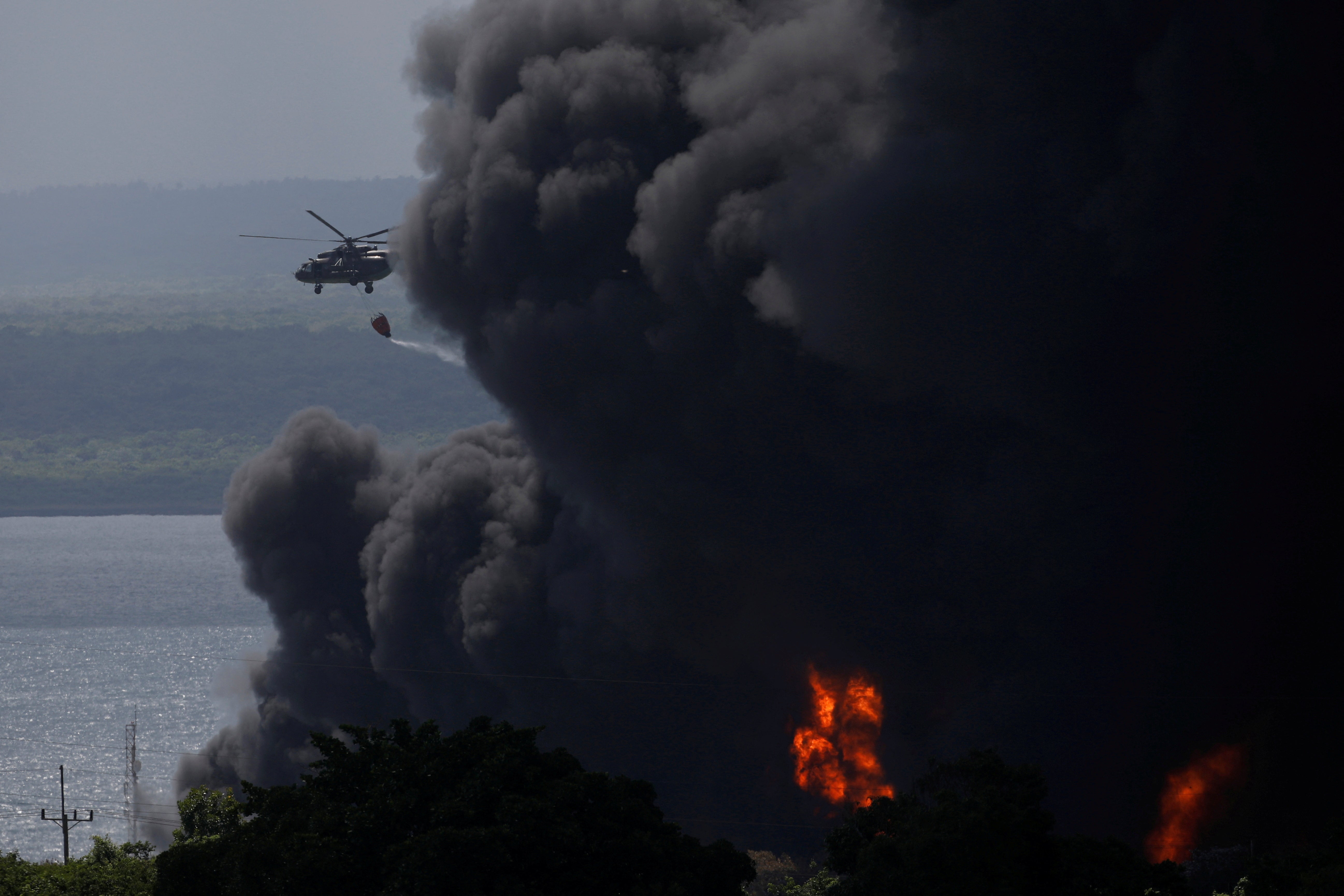 A huge blaze raged through the night after a second tank was hit on Friday evening