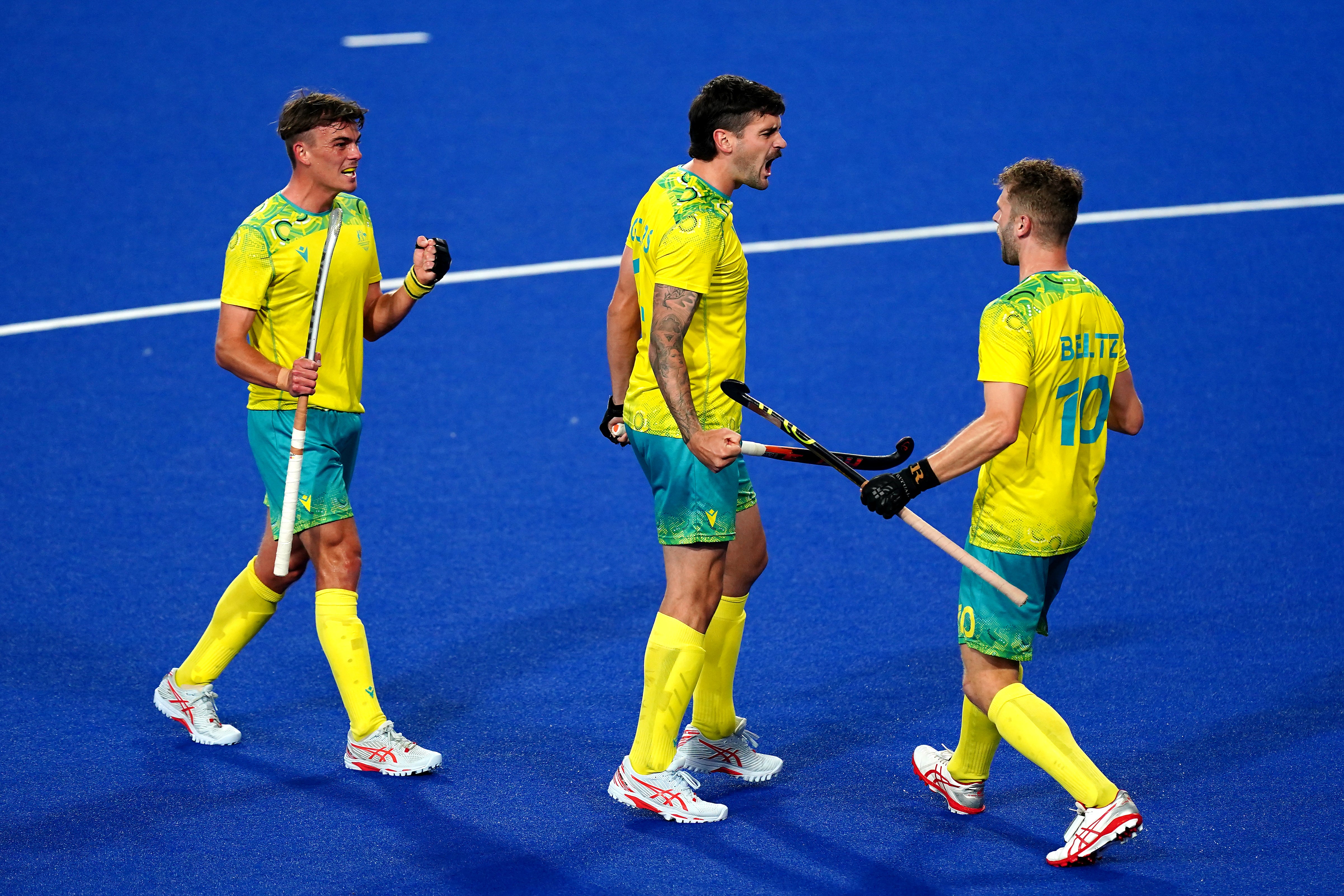 Blake Govers (centre) celebrates scoring Australia’s first goal against England (Mike Egerton/PA)