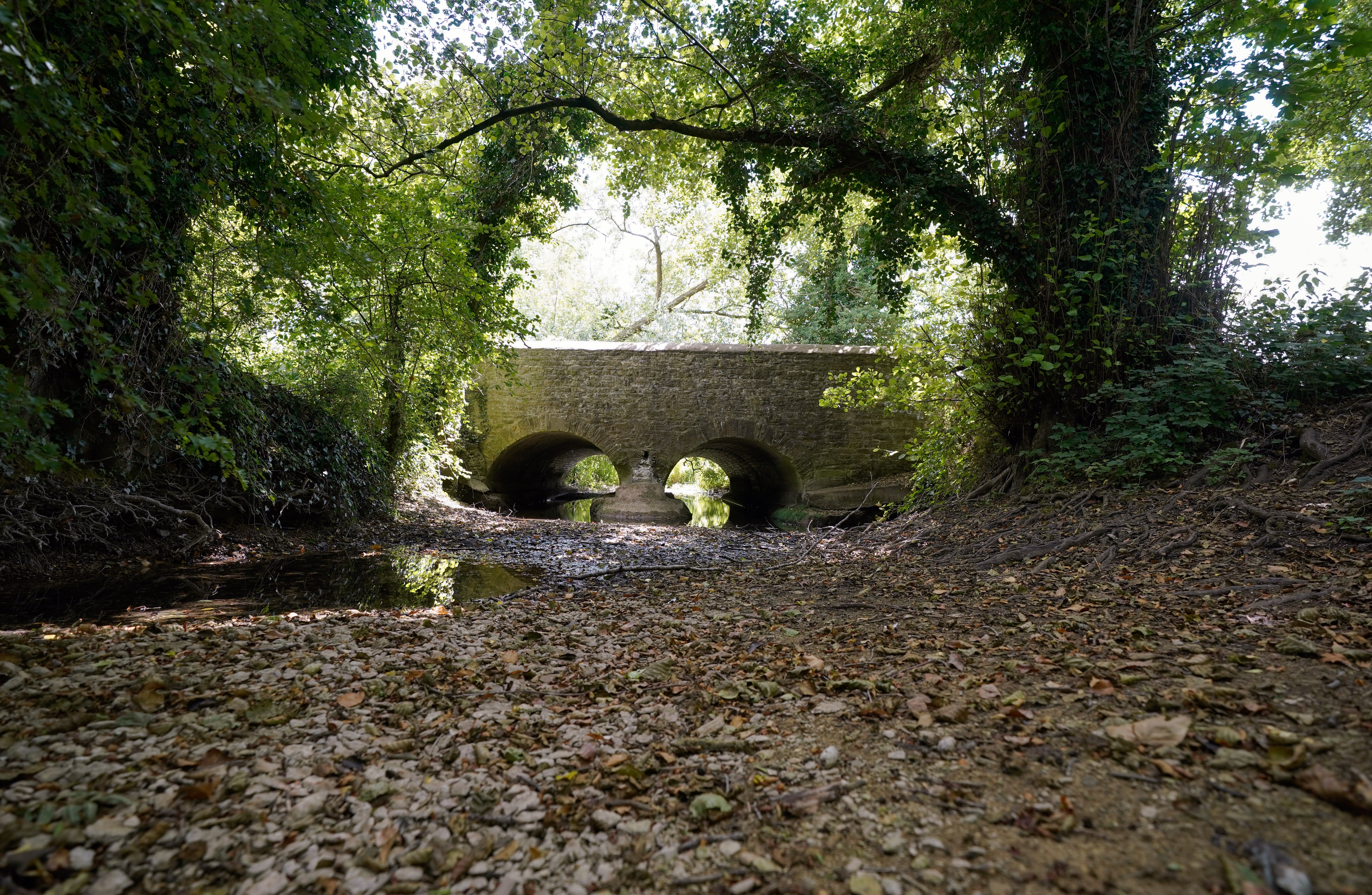 A dried up river bed of the River Thames near to Somerford Keynes in Gloucestershire (Andrew Matthews/PA)