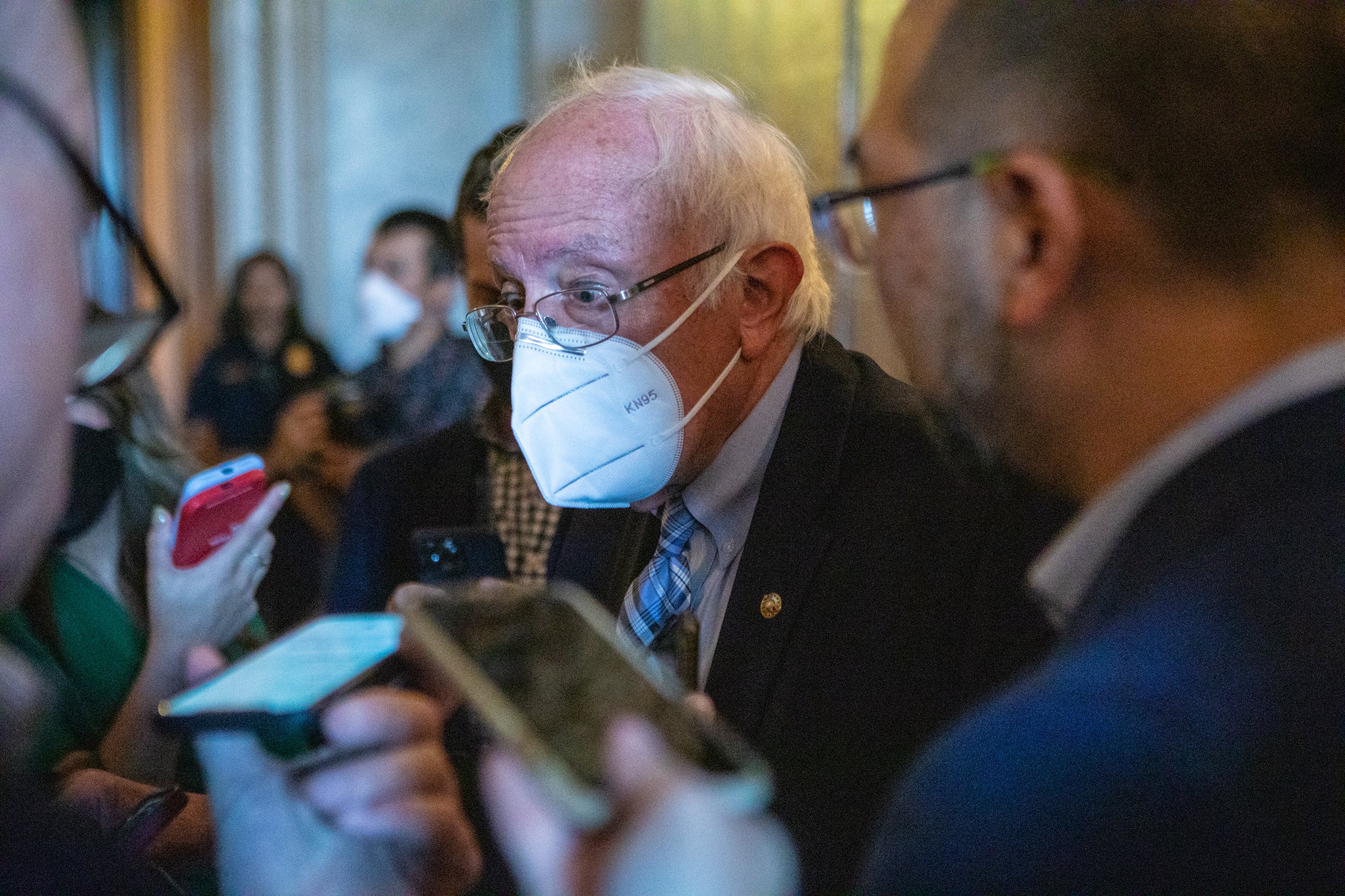 Bernie Sanders speaks to reporters as he arrives for a vote on the Senate floor on 6 August