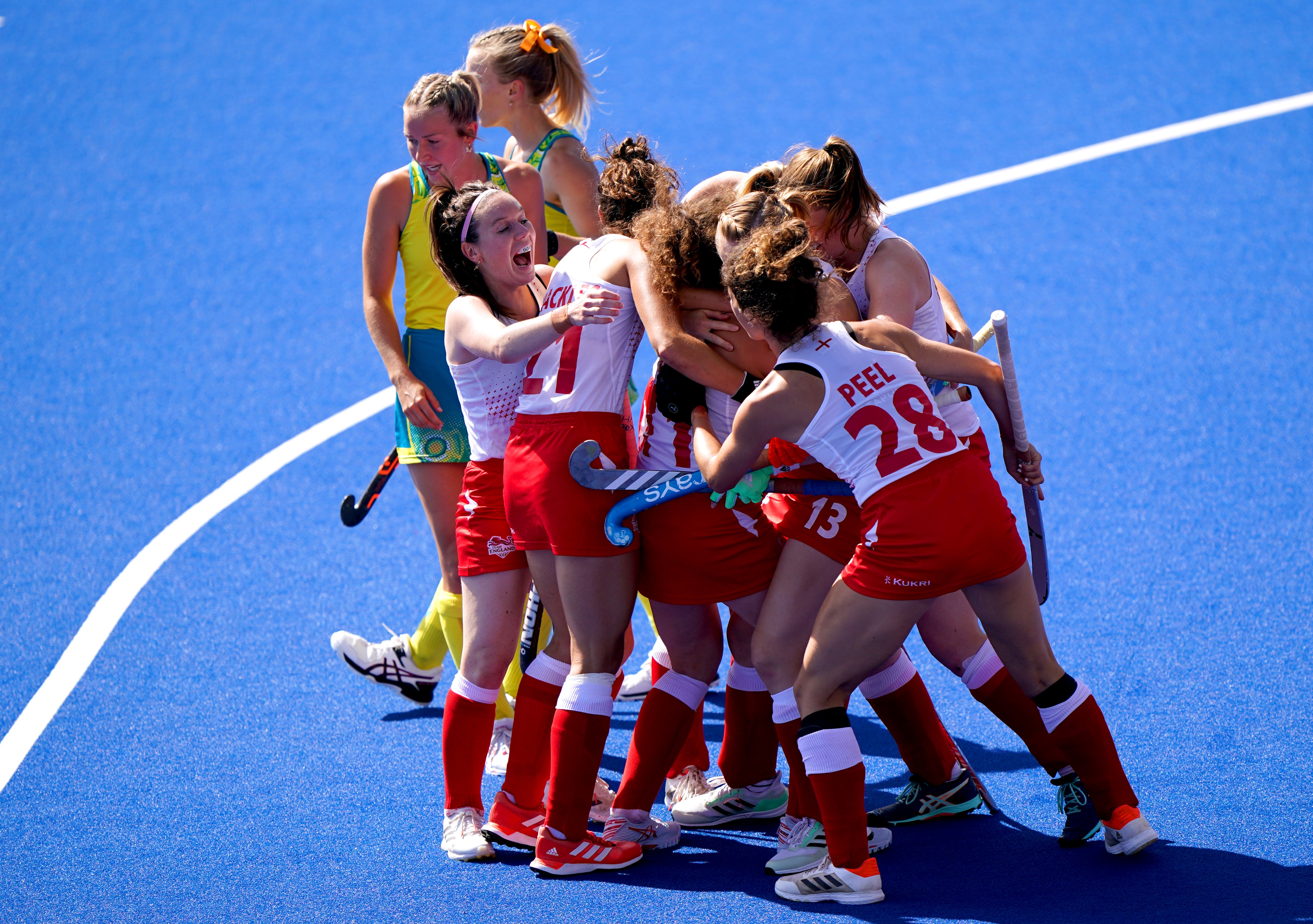 England’s Holly Hunt celebrates with her team-mates after scoring in the final victory over Australia