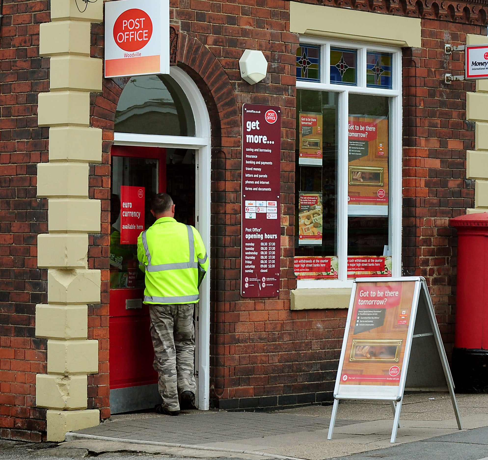 Post offices handled a record £801m in personal cash withdrawals in July (Rui Vieira/PA)