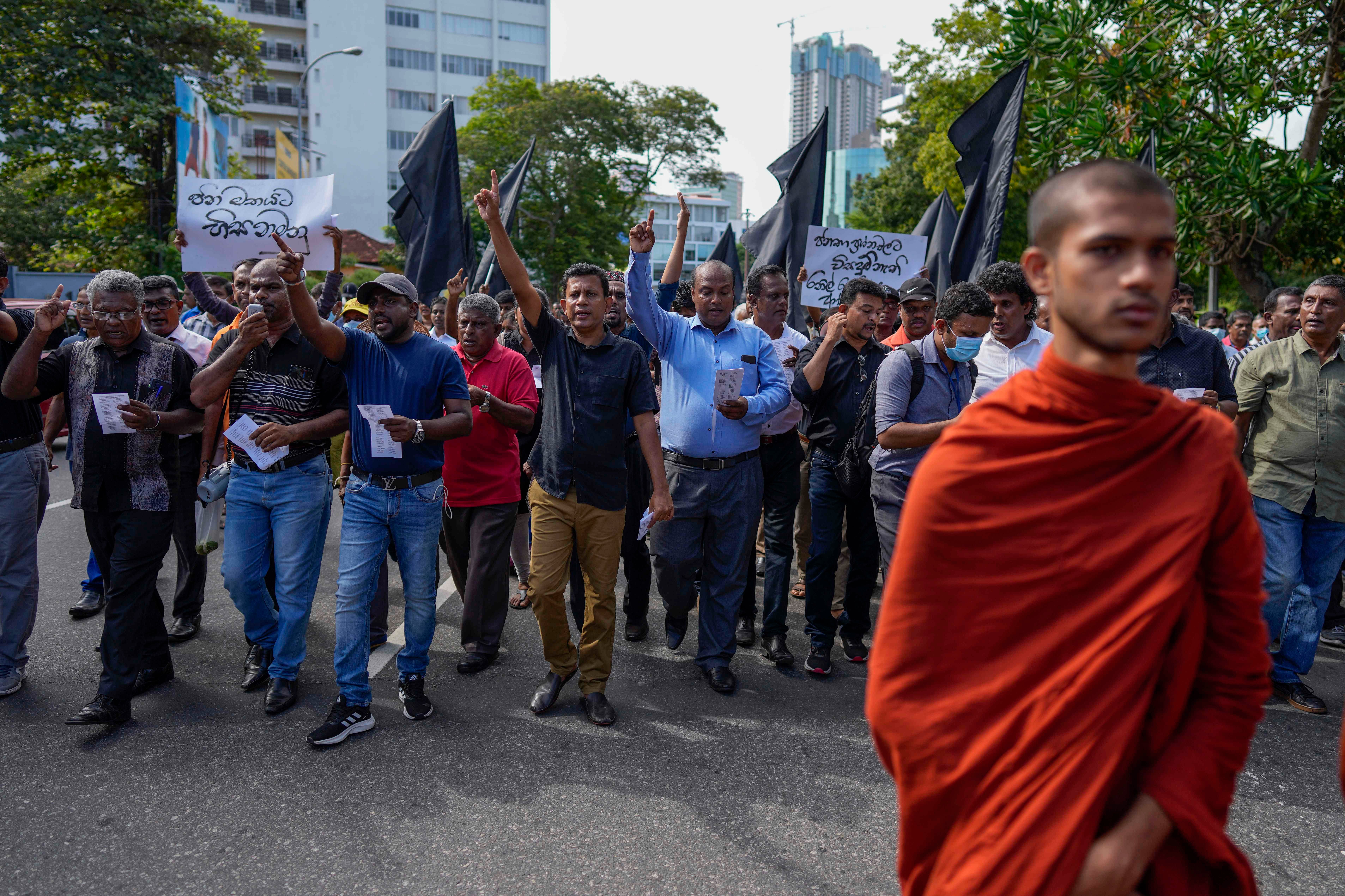 Trade union and civil society activists led by leftists' People Liberation Front shout slogans denouncing president Ranil Wickremesinghe