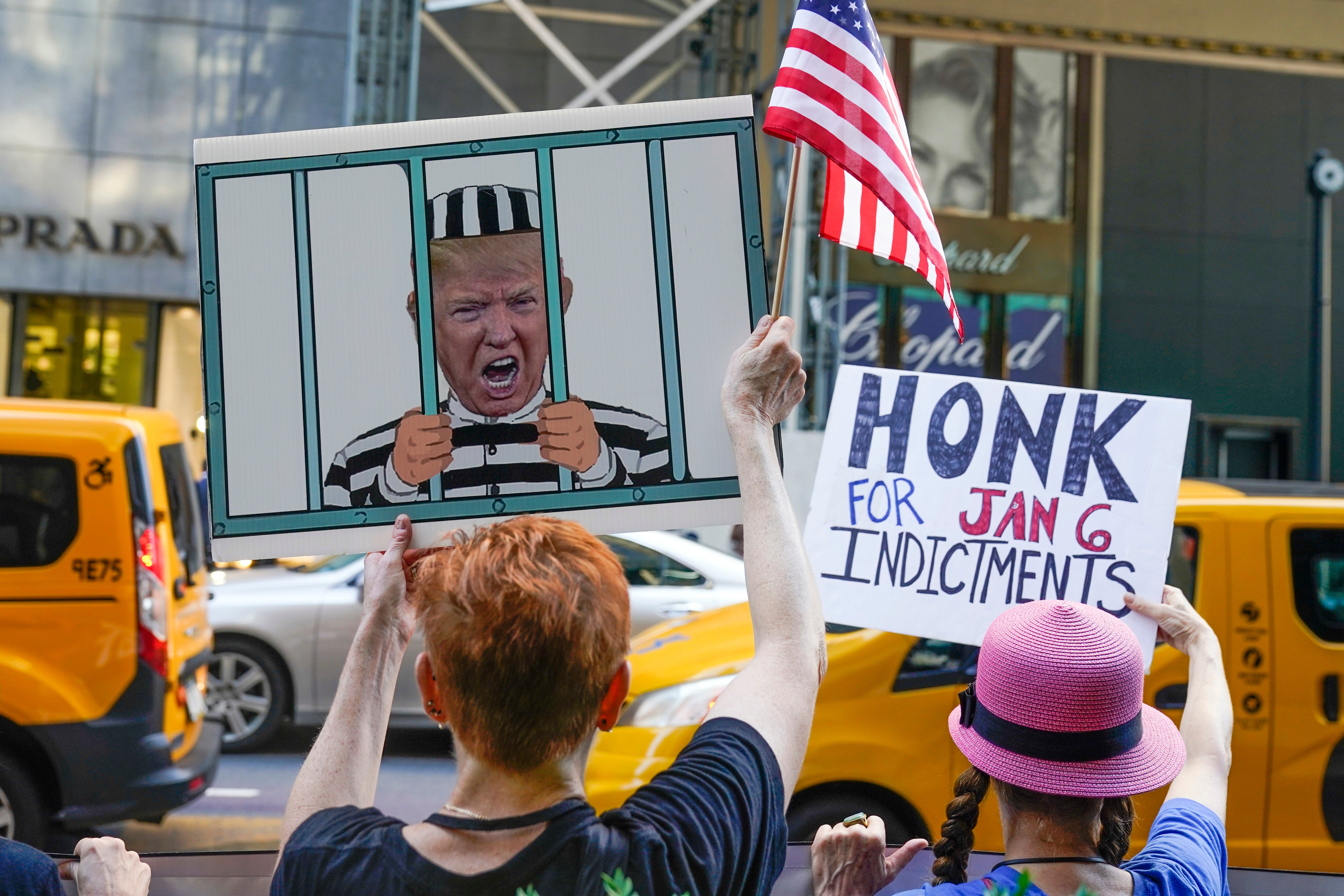 Protesters stand in front of Trump Tower in New York after news that the FBI had searched President Donald Trump’s Mar-a-Lago home in Florida