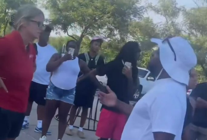 A moment during a confrontation between party attendees and a park official at the water park