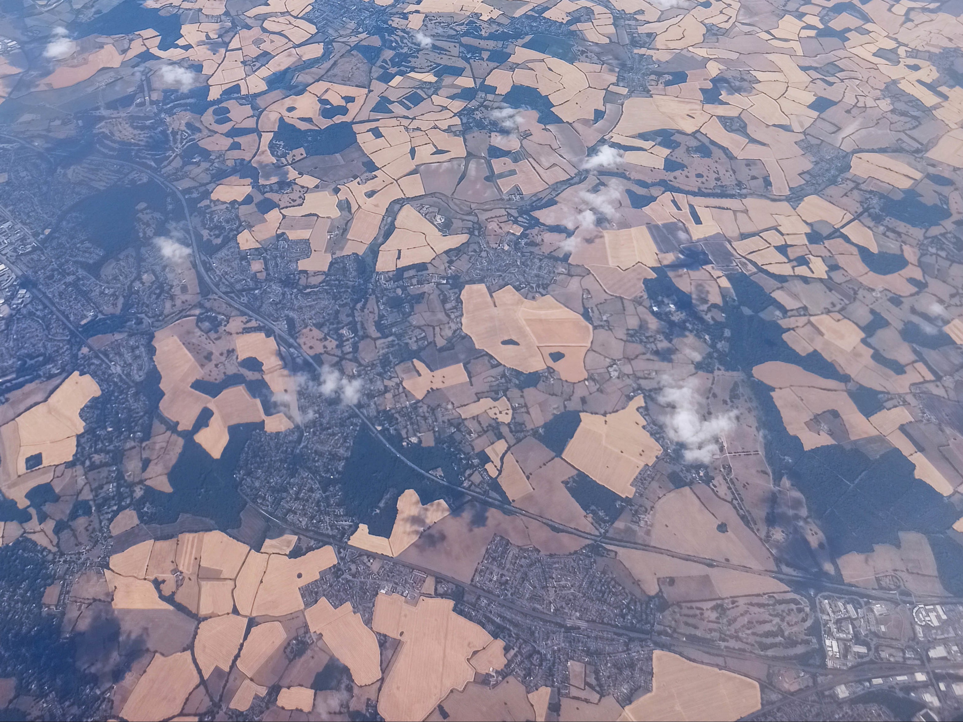 Parched fields north of London seen from a flight that left Gatwick on 8 August