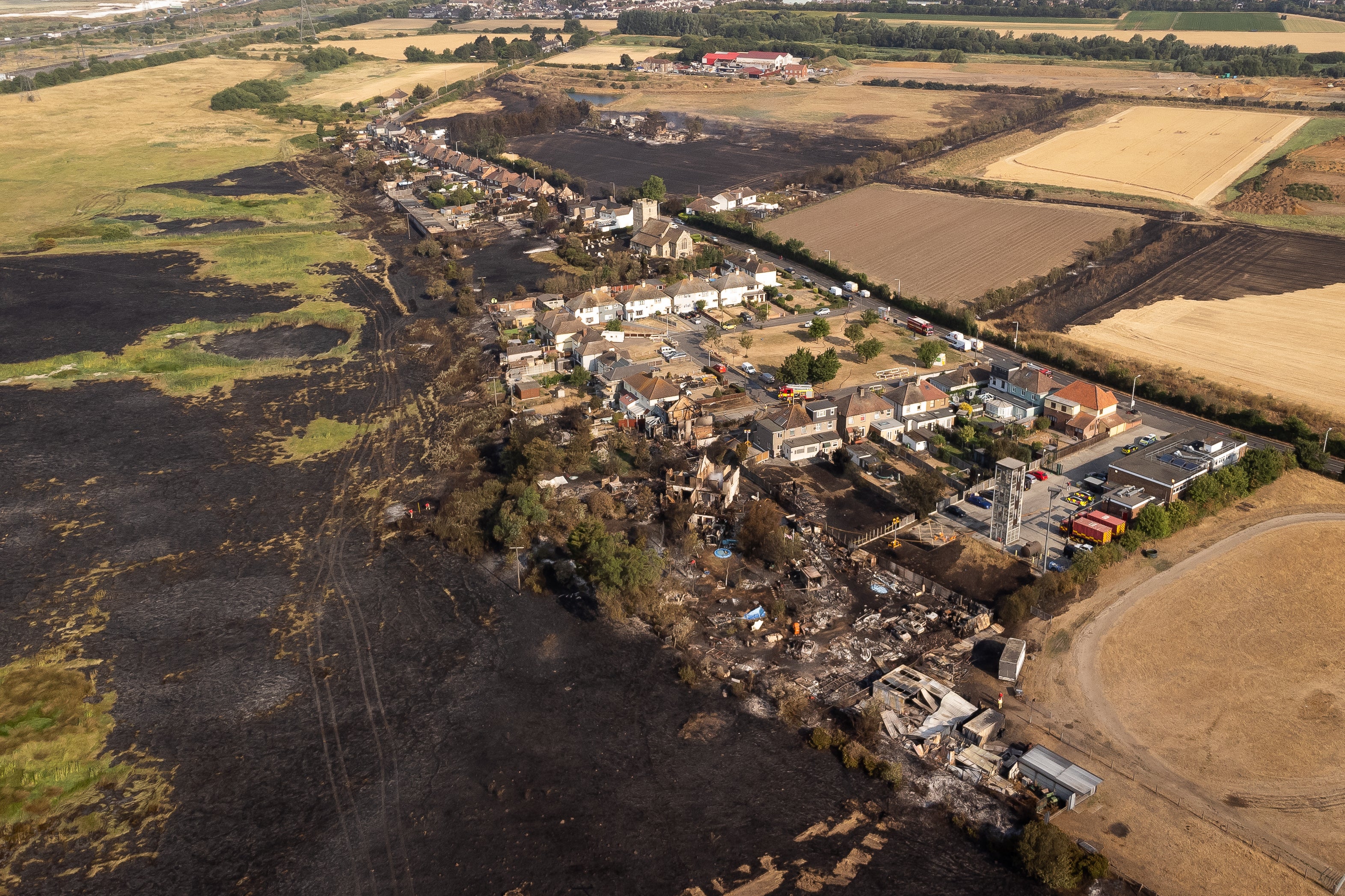 The scene after a blaze in Wennington, east London last month, after record temperatures fuelled fires (Aaron Chown/PA)